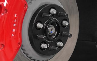 Top 5 Best Tesla Model 3 Wheel Spacers for Racing - Tested By Pros BONOSS Forged Active Cooling Adapters Hubcentric Spacers Pros Before and After Example CHZ (3)