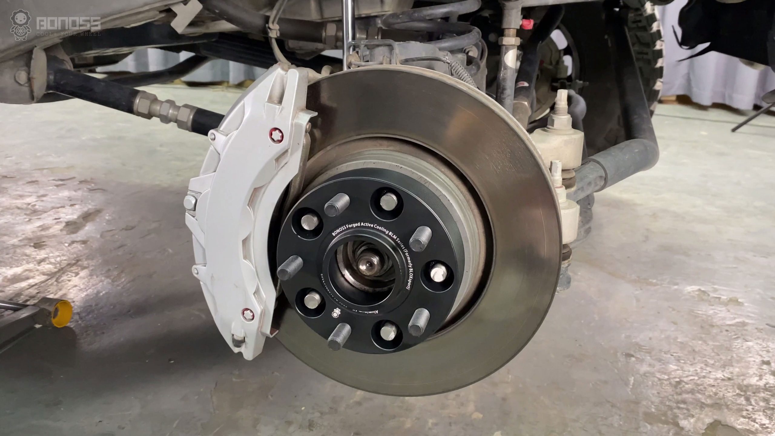 Installing Jeep Wrangler Spacers Follow this 7-Step DIY Guide BONOSS Forged Active Cooling Adapters Hubcentric Spacers Pros Before and After Example (2)