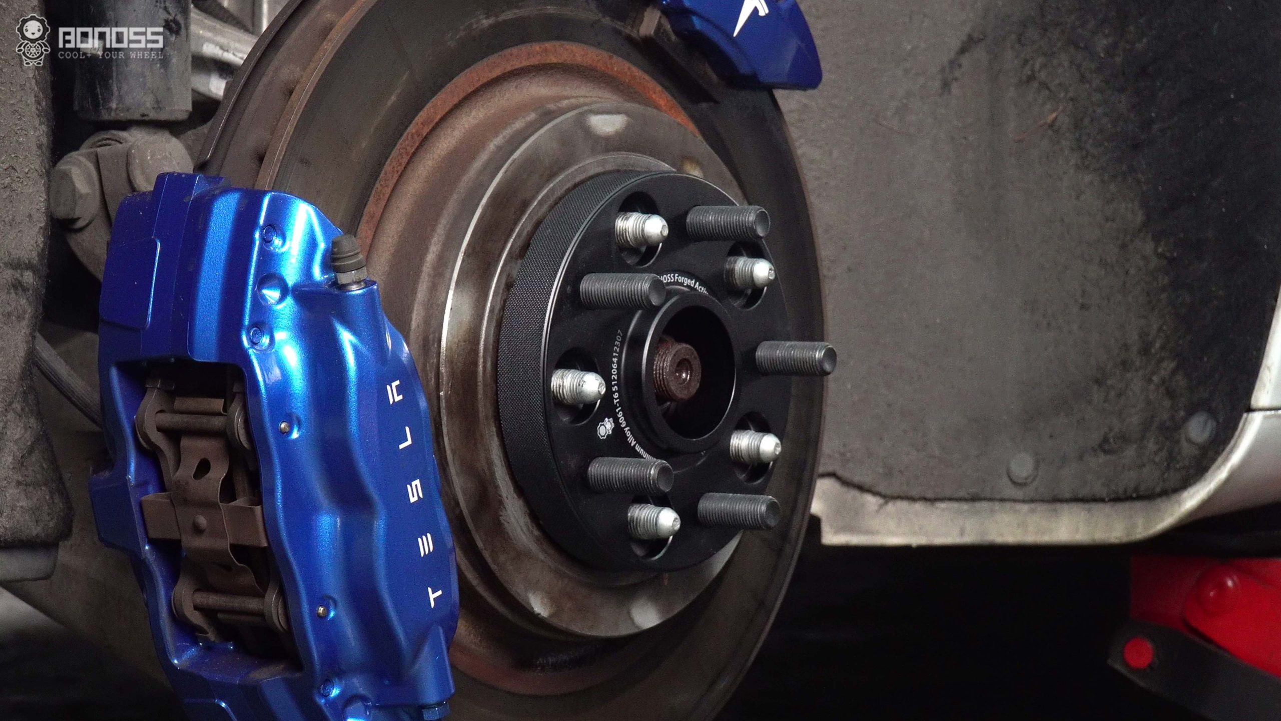 Installing Tesla Model S Spacers Follow this 7-Step DIY Guide BONOSS Forged Active Cooling Adapters Hubcentric Spacers Pros Before and After Example (2)