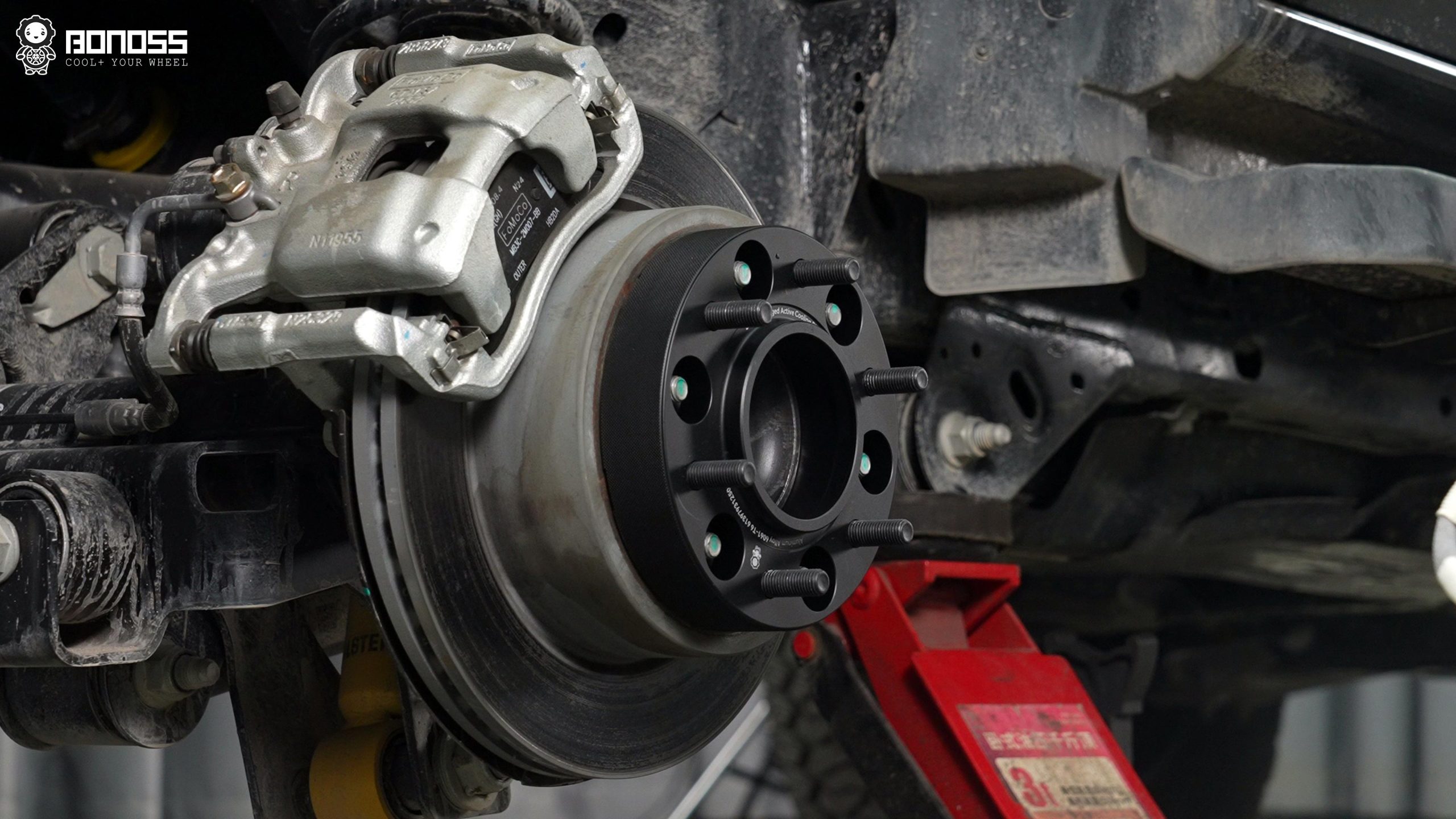 BONOSS Forged Active Cooling Hubcentric Bronco Wheel Spacers (8) A 35mm Bronco wheel spacer is installed on the wheel hub.