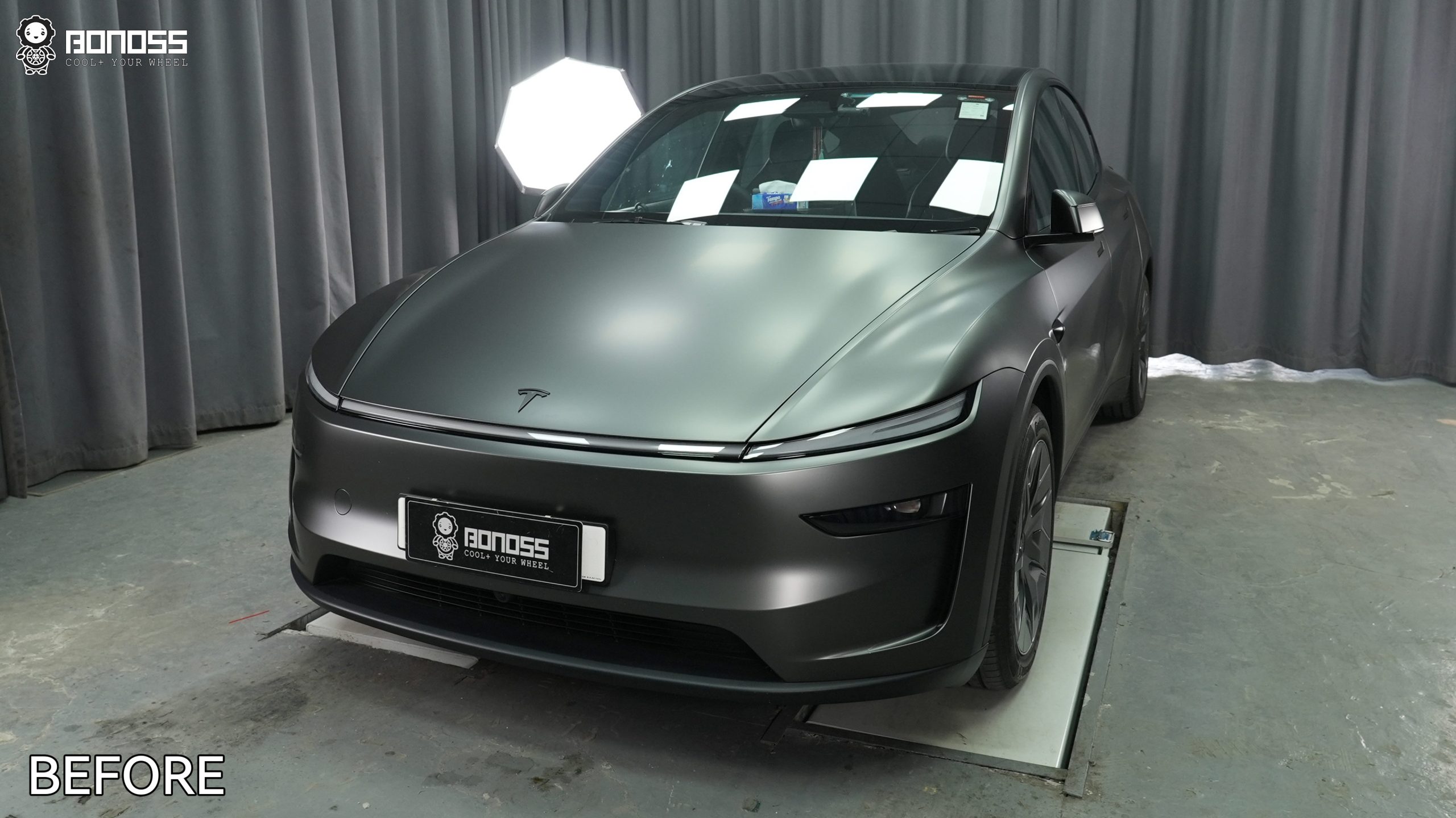 2026-tesla-model-y-before-wheel-spacers-side-view 2026 Tesla Model Y stock stance before installing 20mm wheel spacers