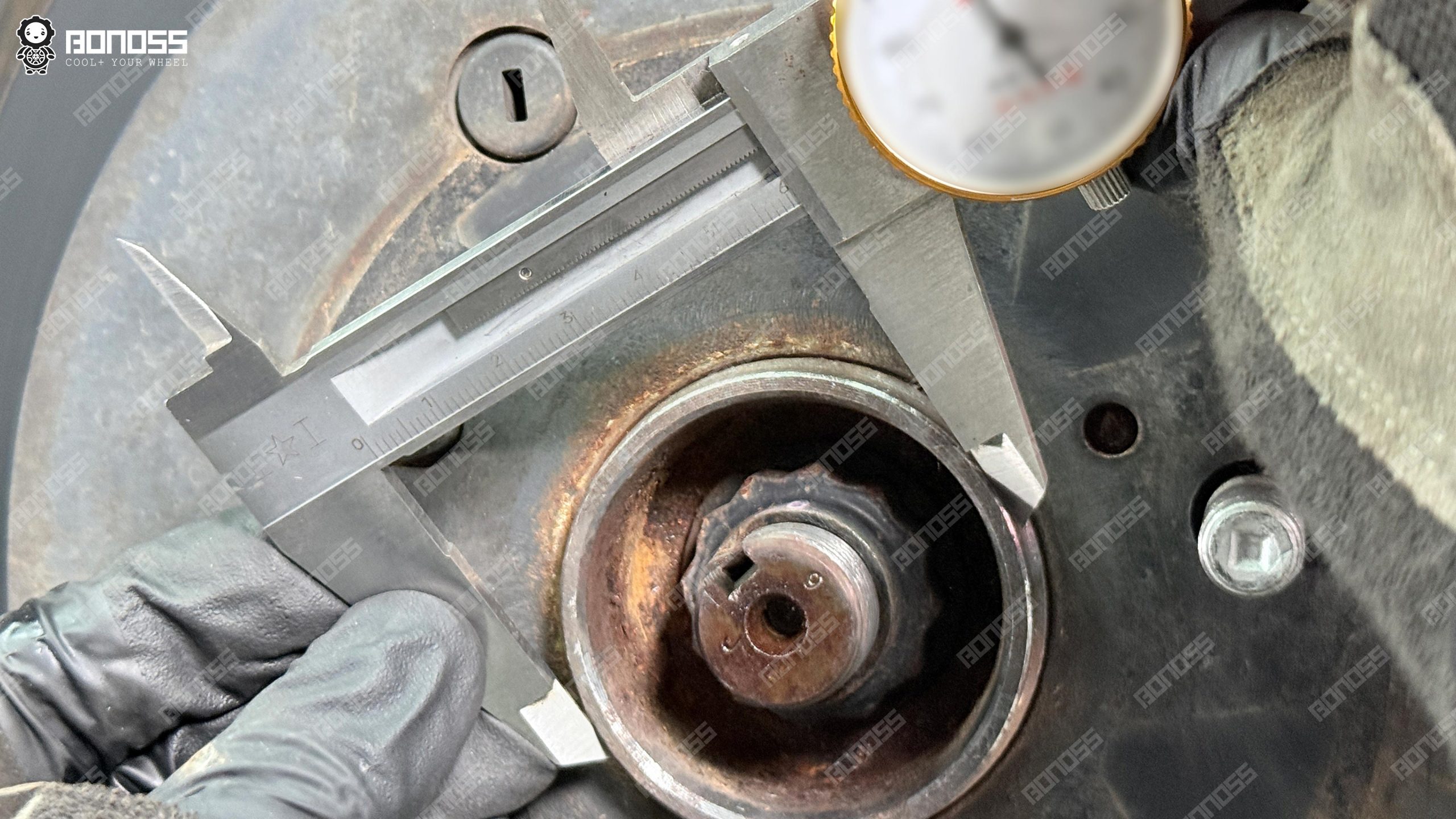 measure-toyota-highlander-hub-bore-diameter Measuring 60.1mm hub bore diameter on a 2018 Toyota Highlander for hub-centric wheel spacers