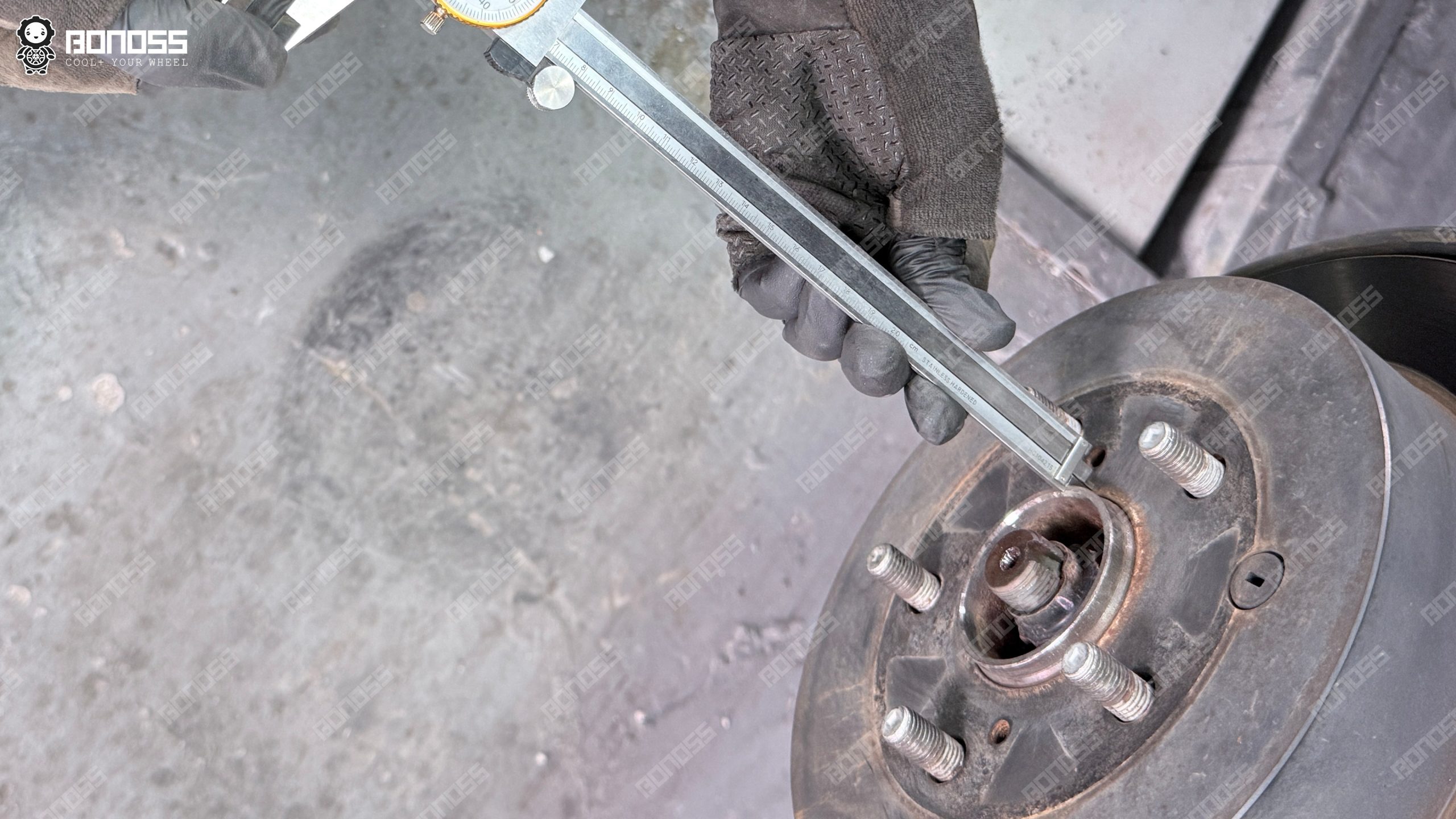 measure-toyota-highlander-hub-step-height Measuring hub step height on a 2018 Toyota Highlander before installing hub-centric wheel spacers