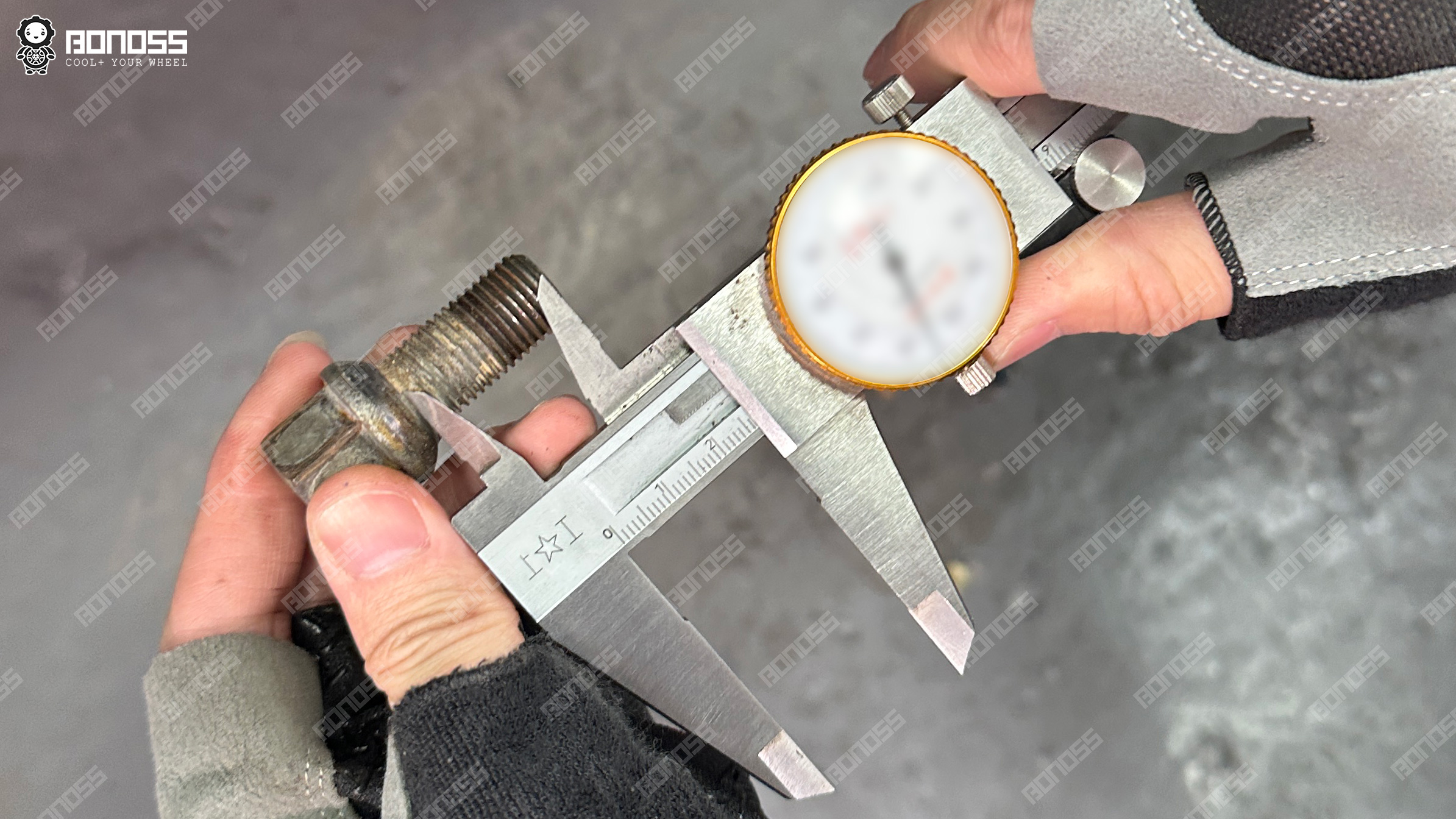 measuring-stock-wheel-bolt-27mm-thread-r14-ball-seat Measuring the 27mm thread length of the stock R14 ball seat wheel bolt