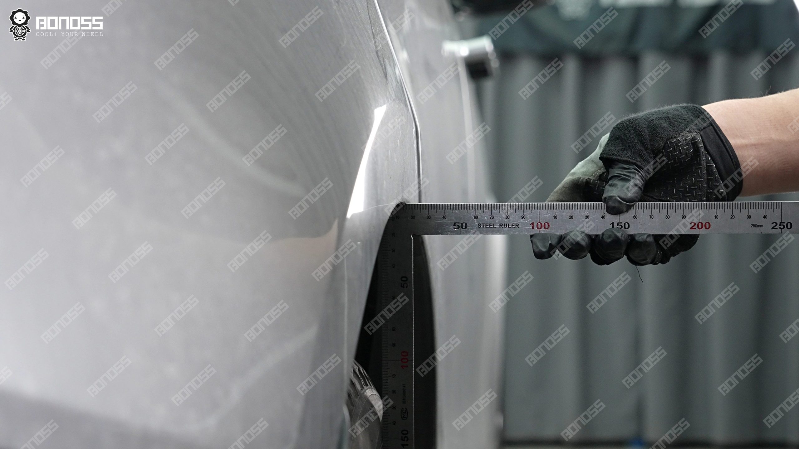2026-land-rover-range-rover-sport-flush-measurement-rear-right-ruler High-accuracy ruler measuring rear-right flush gap on a 2026 Land Rover Range Rover Sport before wheel spacer install