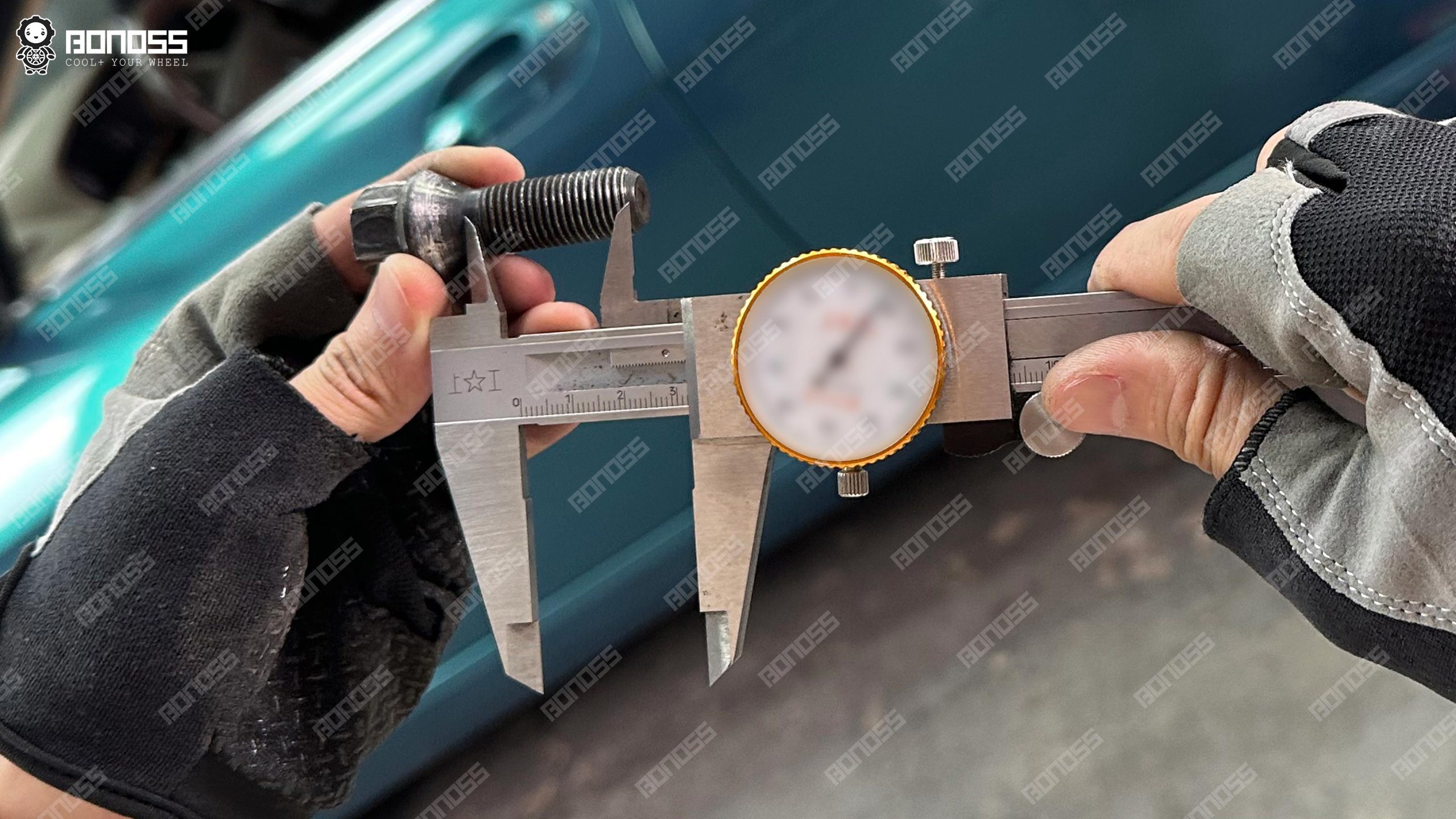 bmw-e65-factory-bolt-thread-length-vernier-caliper Vernier caliper measuring BMW E65 M14x1.5 factory wheel bolt thread length 32mm