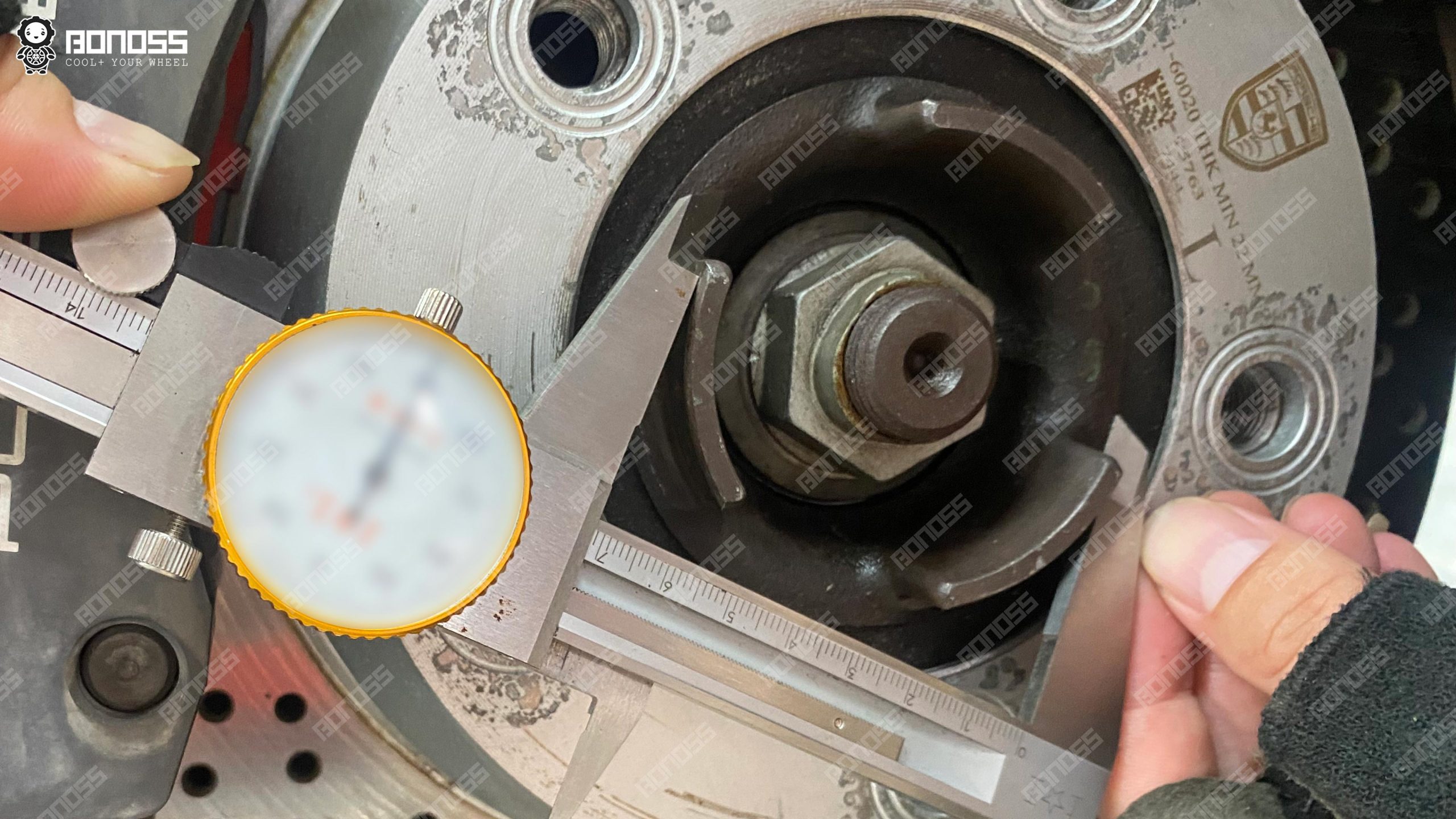 measuring-porsche-cayman-hub-center-bore-caliper Vernier caliper measuring the 71.56mm hub center bore of a Porsche Cayman for wheel spacers