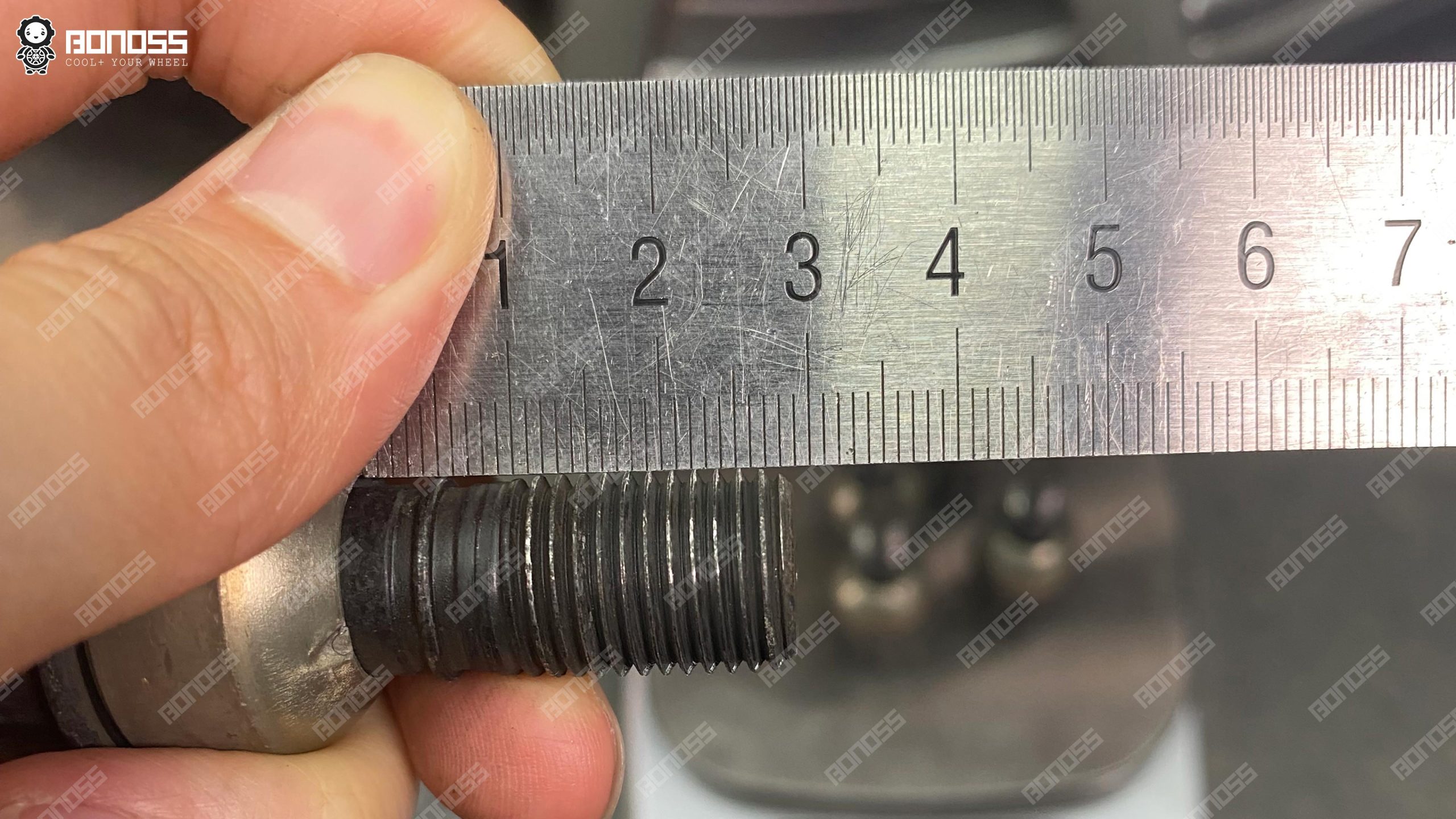 measuring-porsche-cayman-wheel-bolt-thread-length Measuring the factory M14x1.5 wheel bolt thread length before fitting extended bolts