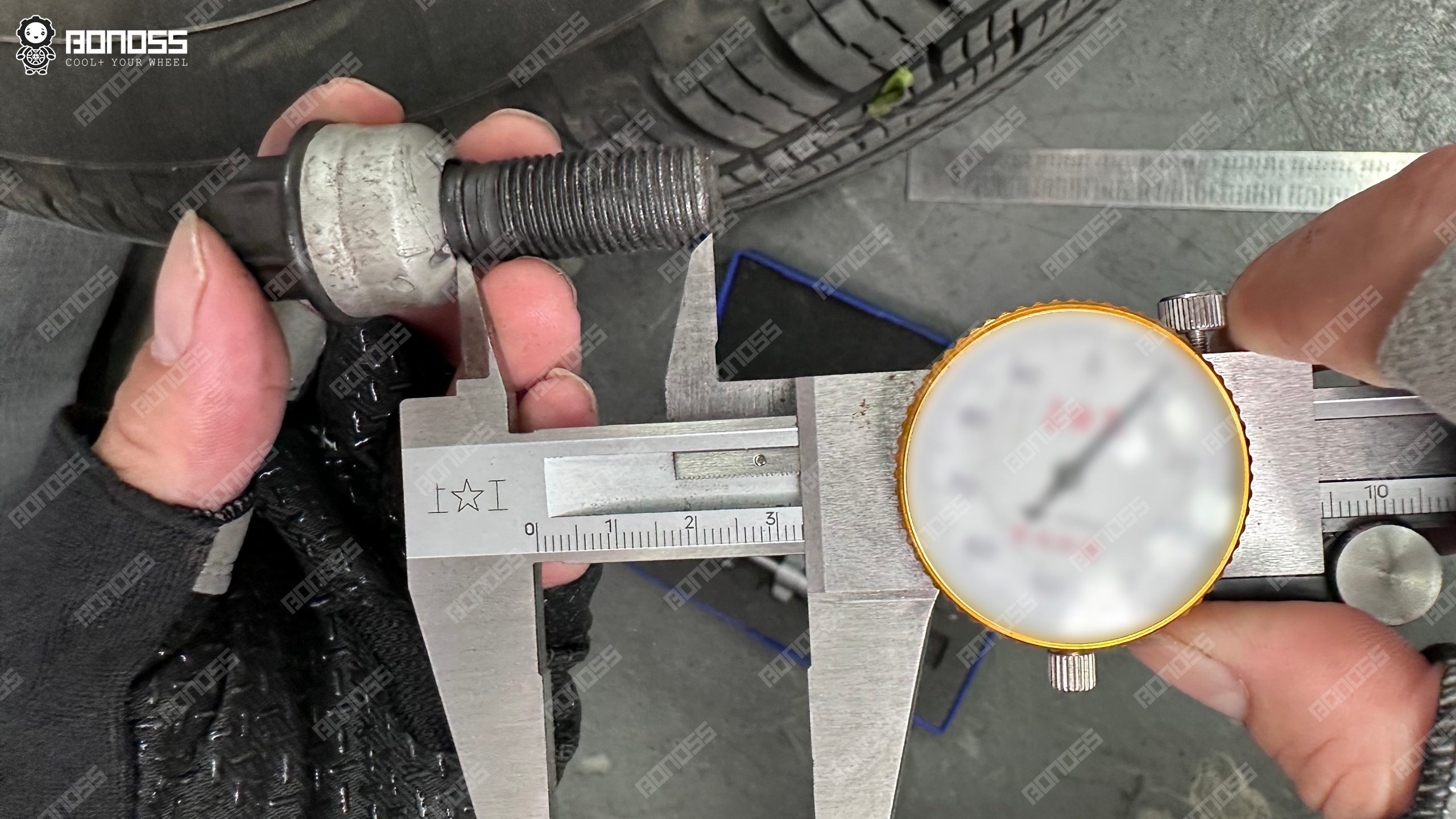 porsche-cayenne-oem-bolt-thread-length-caliper-32mm Vernier caliper measuring 32mm of thread below the seat on a stock Porsche Cayenne wheel bolt