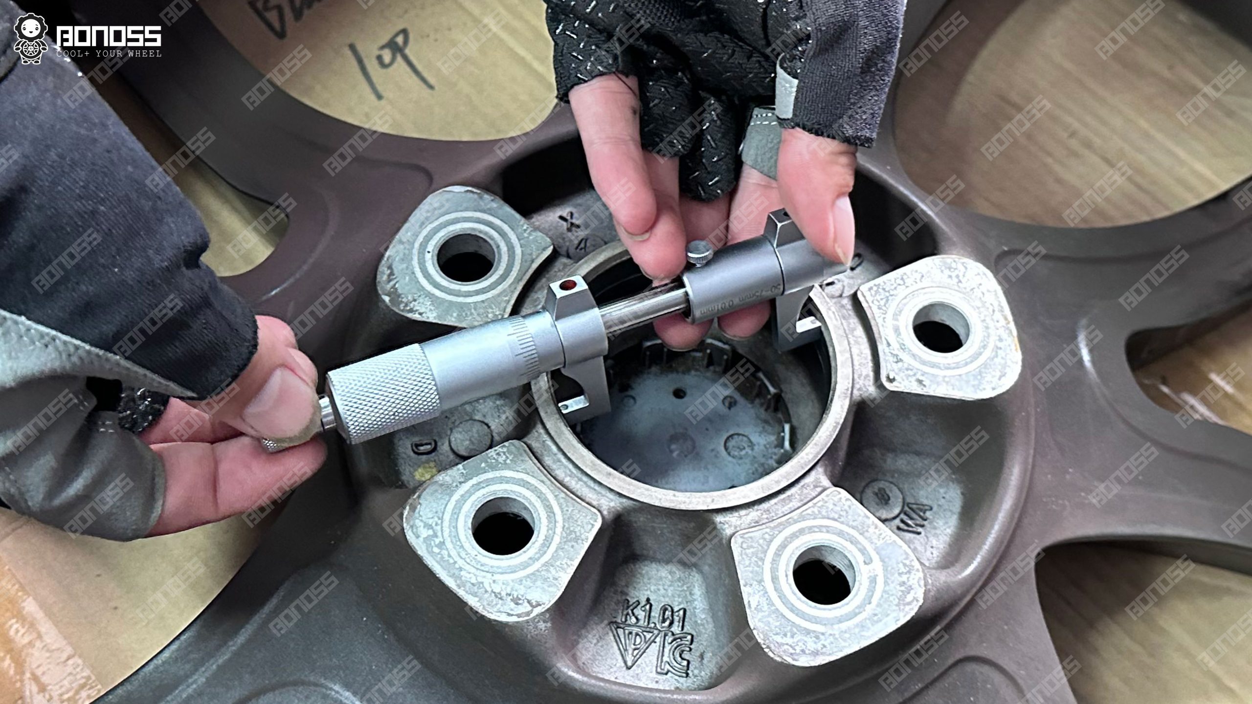porsche-cayenne-wheel-center-bore-micrometer-71.6mm Micrometer measuring the stock wheel center bore at 71.6mm on a 2023 Porsche Cayenne