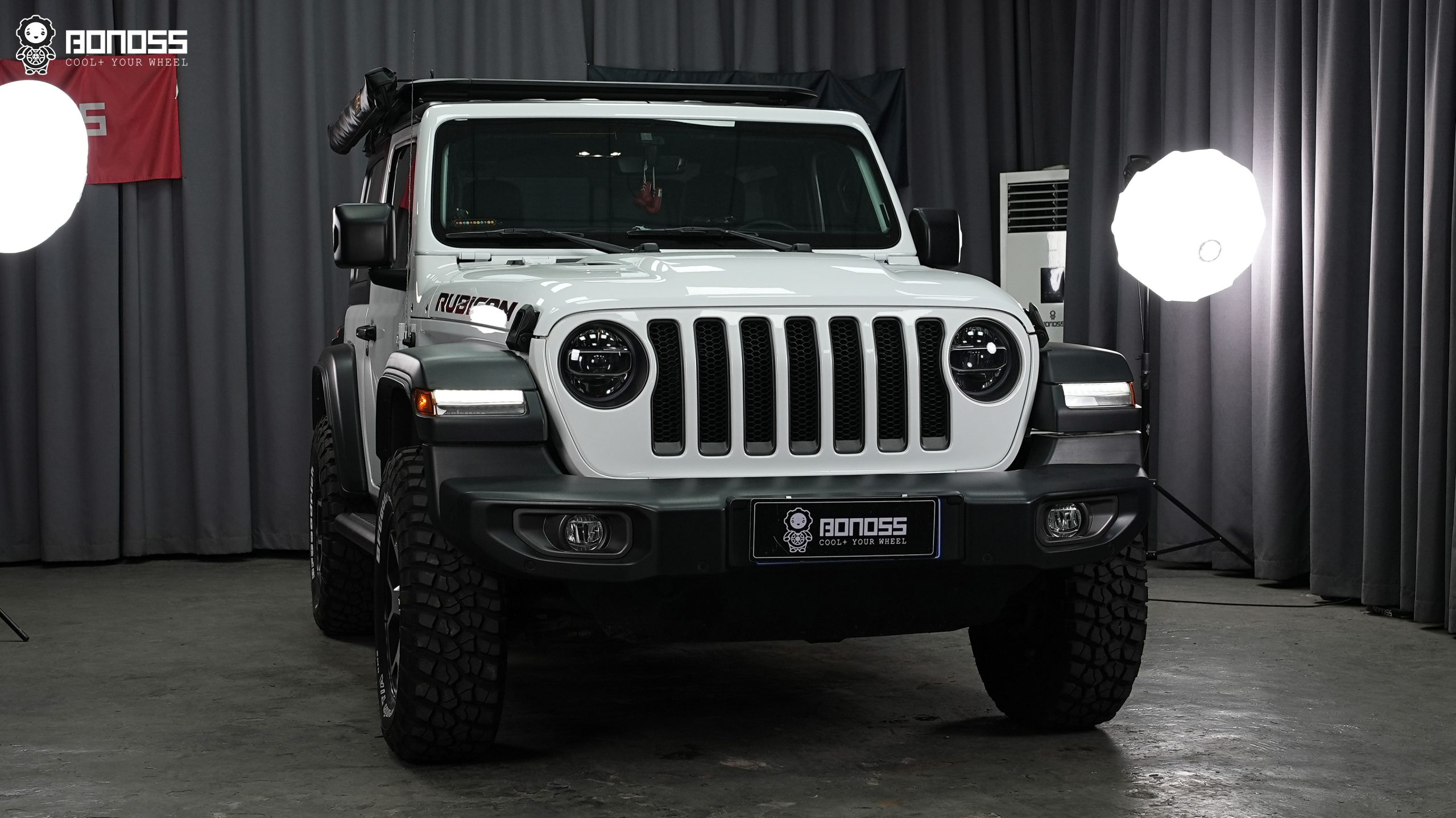 Completed 2021 Jeep Wrangler JL Rubicon parked at the same angle showing the widened stance achieved with hub-centric spacers.