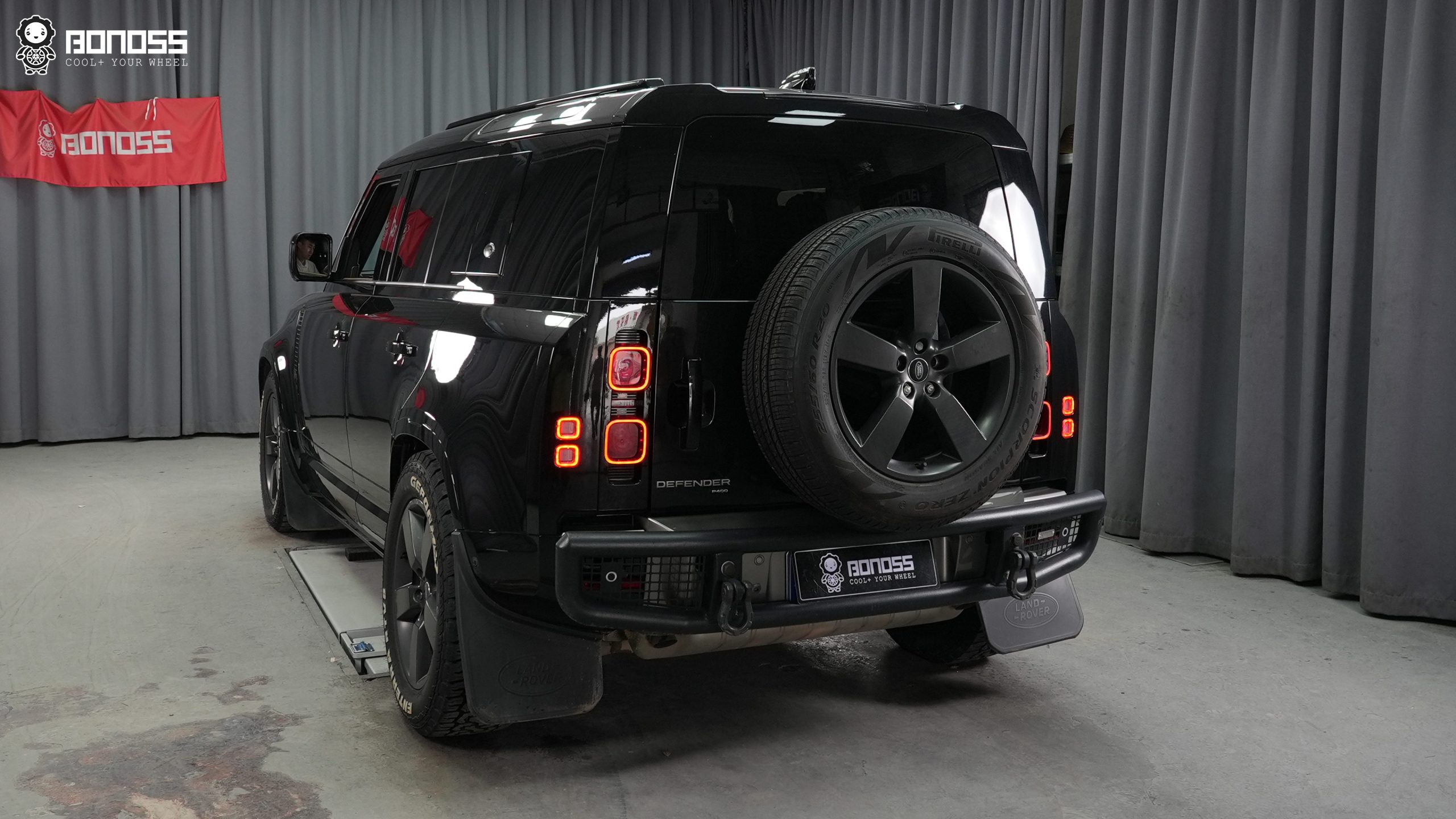 2023-land-rover-defender-35mm-wheel-spacers-after-installation-left-rear Truck shown from behind after 2023 Land Rover Defender 35mm wheel spacers widened the rear track.