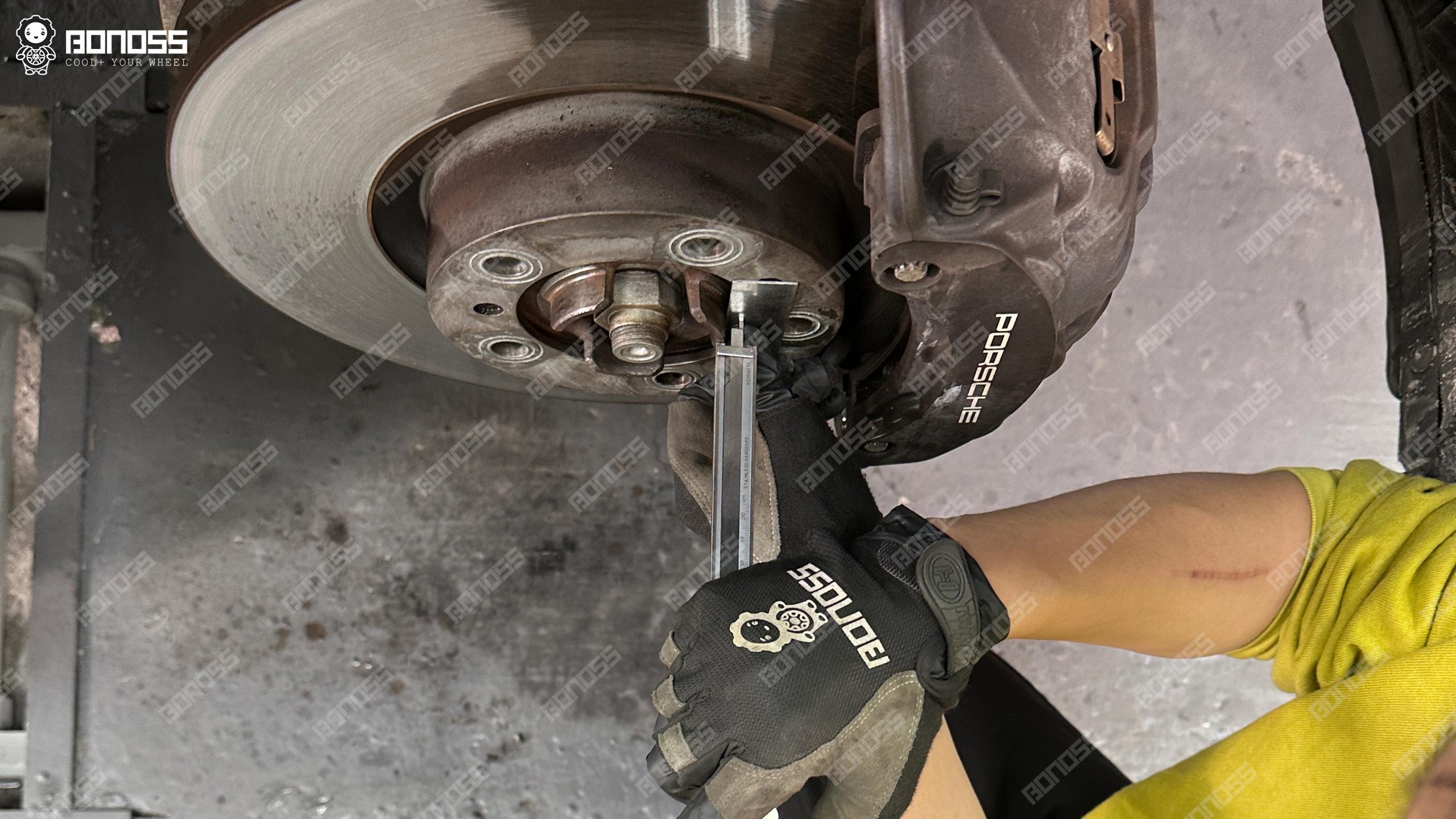 2023-porsche-taycan-hub-step-height-vernier-caliper-measurement Vernier caliper checking hub step height on a 2023 Porsche Taycan hub.