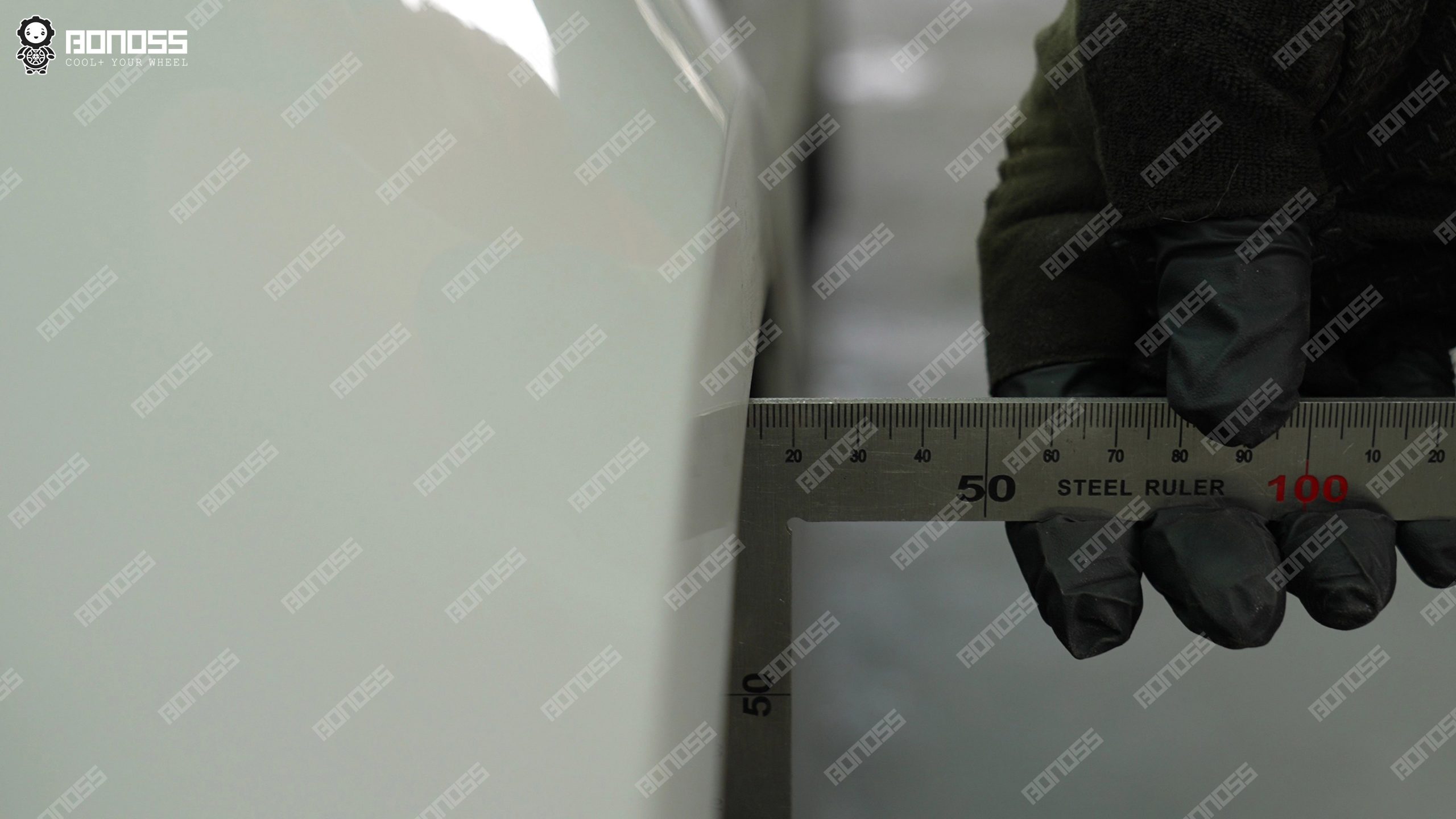 2023-porsche-taycan-rear-right-fender-gap-ruler-measurement Rear-right clearance measurement on the 2023 Porsche Taycan for spacer thickness.
