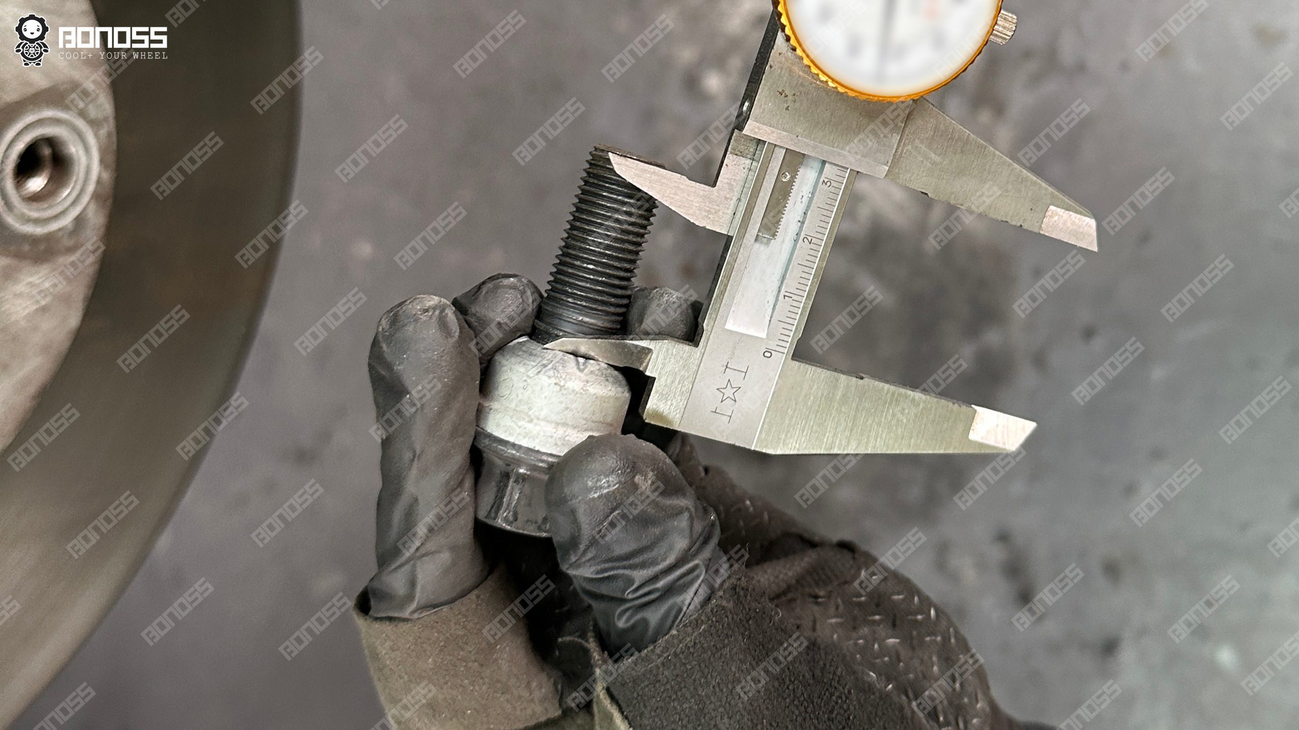 2023-porsche-taycan-wheel-bolt-length-caliper-measurement Measuring stock bolt length on the 2023 Porsche Taycan for extended bolt sizing.