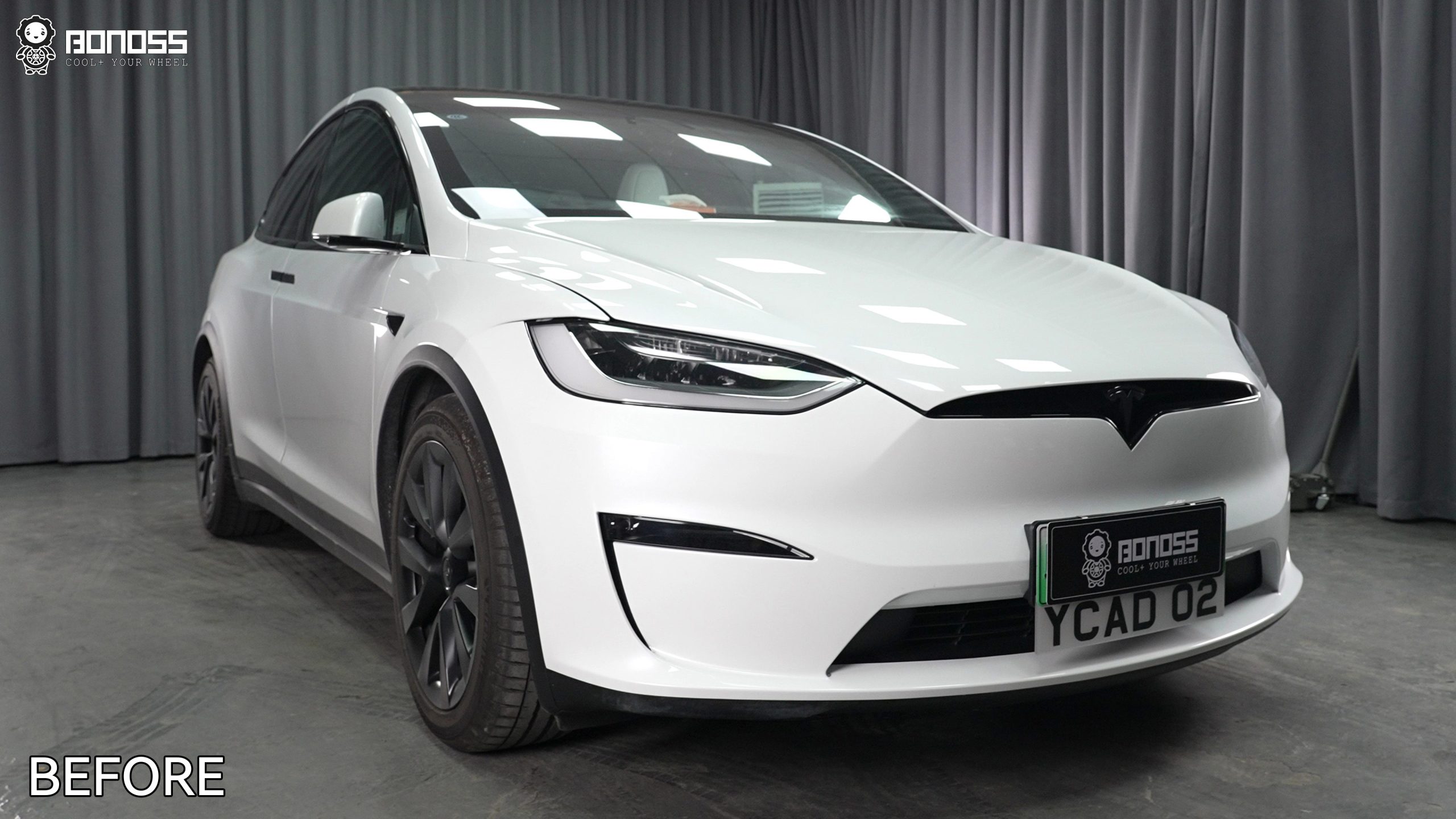 2023-tesla-model-x-before-20mm-wheel-spacer-installation-front-view Stock 2023 Tesla Model X with OEM wheels recessed behind the fender line prior to upgrades.