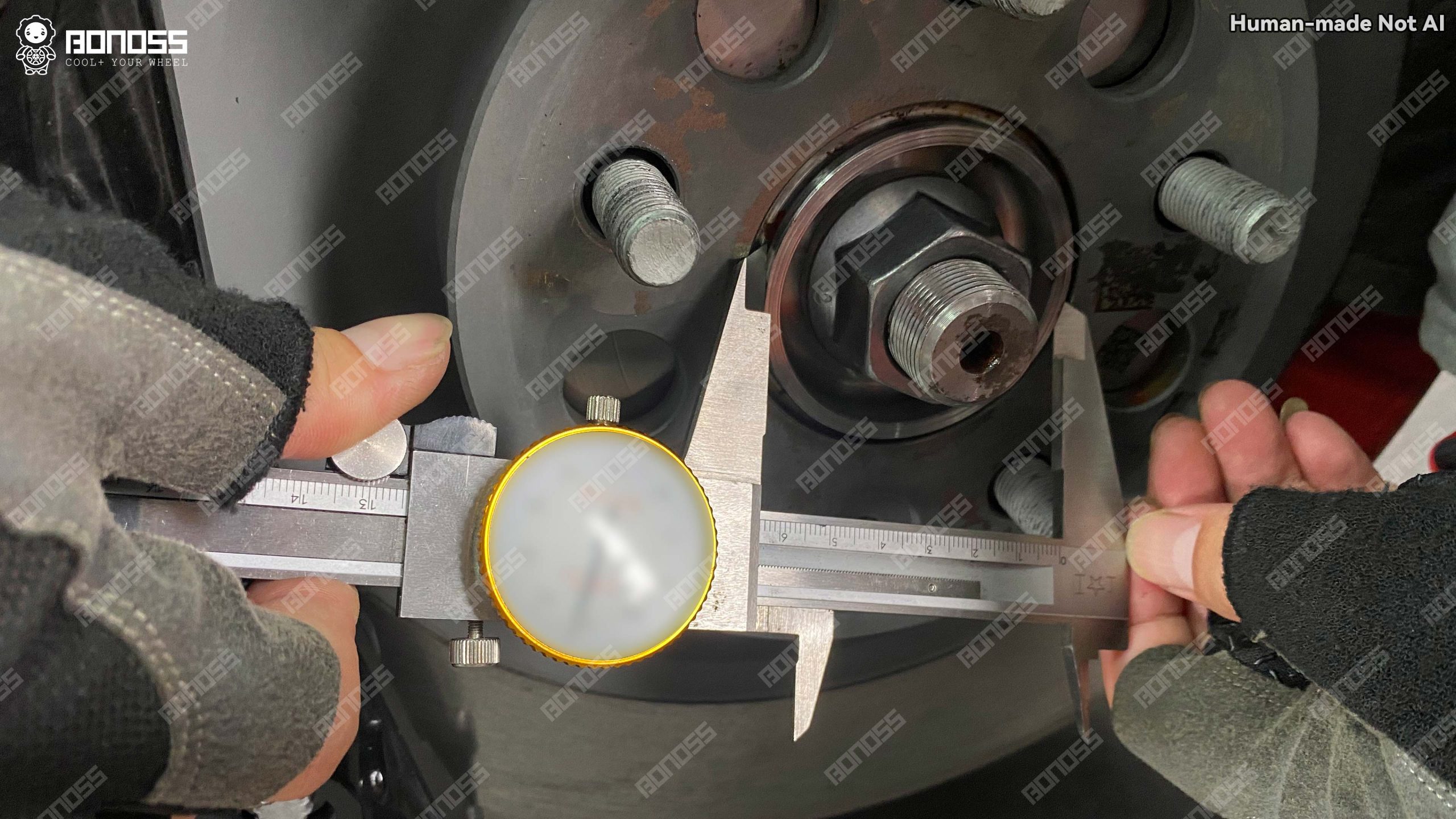 2023-tesla-model-x-hub-bore-diameter-measured-with-vernier-caliper Measuring the 64.03mm hub register diameter on a 2023 Tesla Model X front axle.