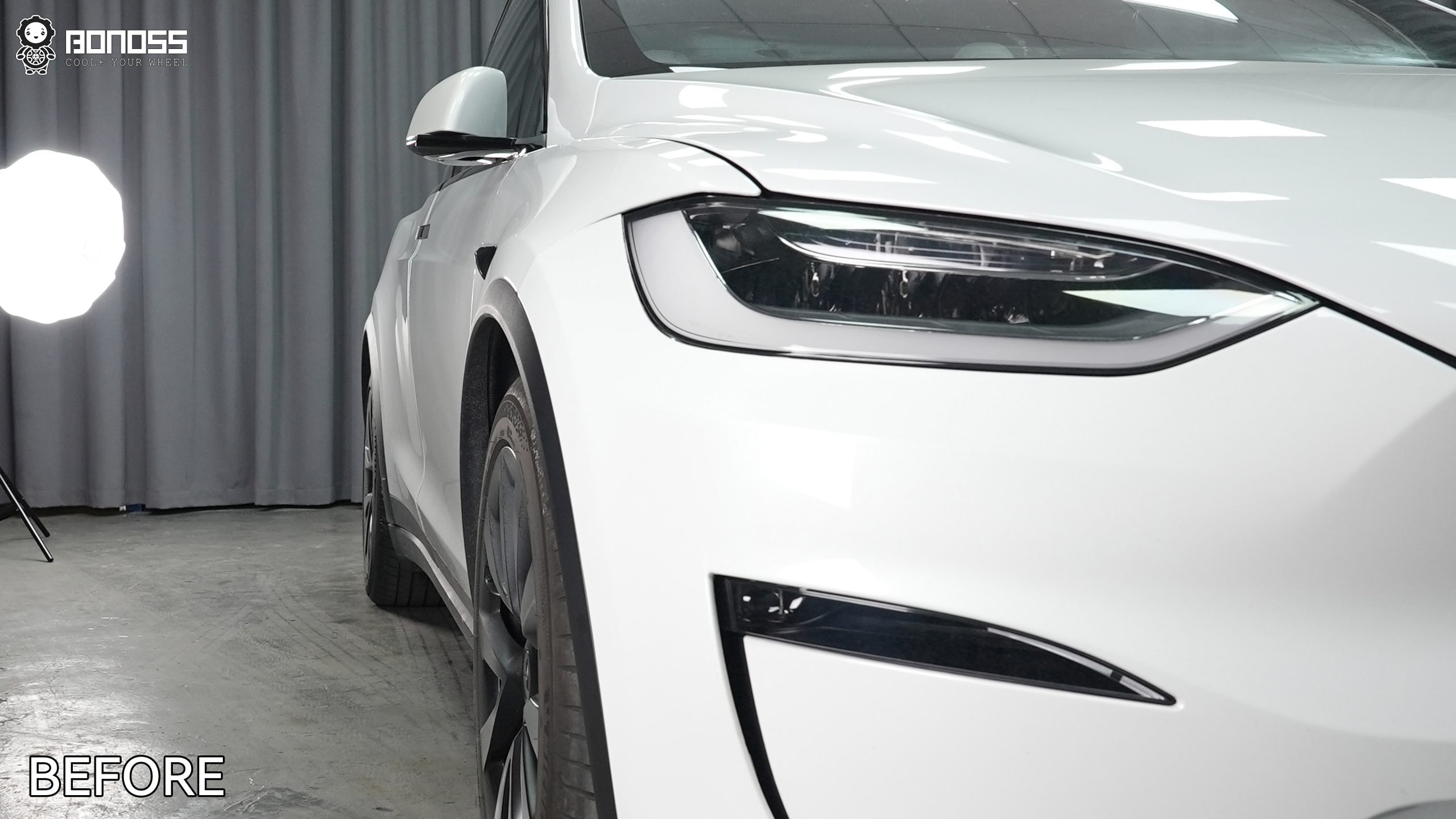 2023-tesla-model-x-left-front-wheel-before-spacer-fitted Tucked OEM left front wheel on a 2023 Tesla Model X prior to spacer fitment.