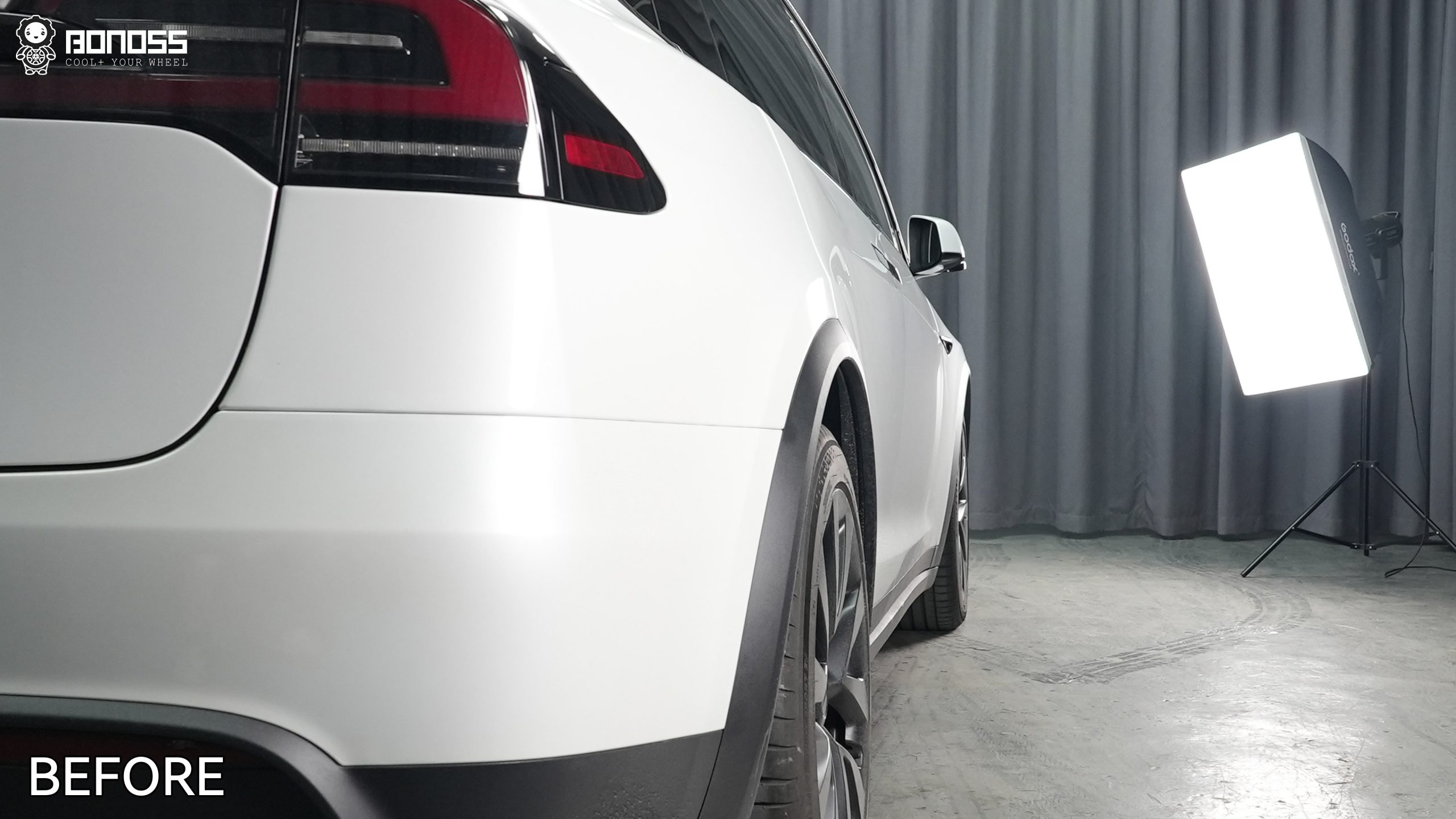 2023-tesla-model-x-right-rear-wheel-in-factory-recessed-position Recessed right rear wheel on an unmodified 2023 Tesla Model X photographed at ride height.