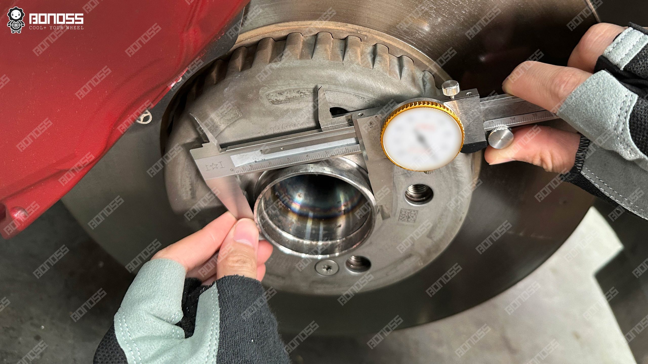 axle-hub-center-bore-measurement-for-w213-hub-centric-wheel-spacers Close-up of a vernier caliper reading 66.42mm on the axle hub register for W213 hub-centric wheel spacers.