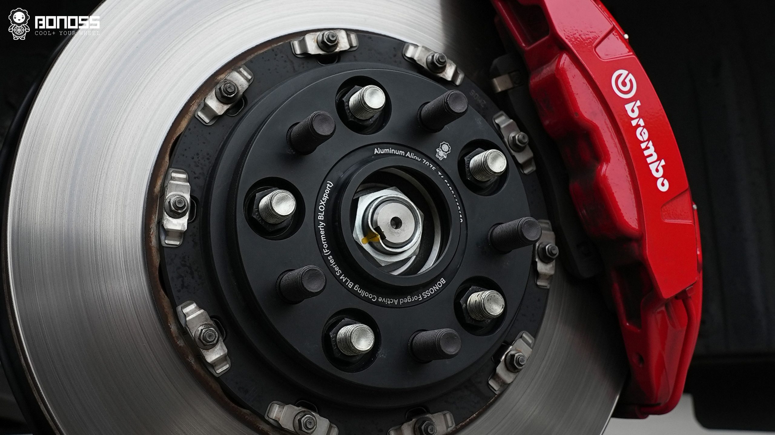 Front axle hub of a Honda Civic Type R fitted with BONOSS forged wheel spacers before wheel reinstallation.