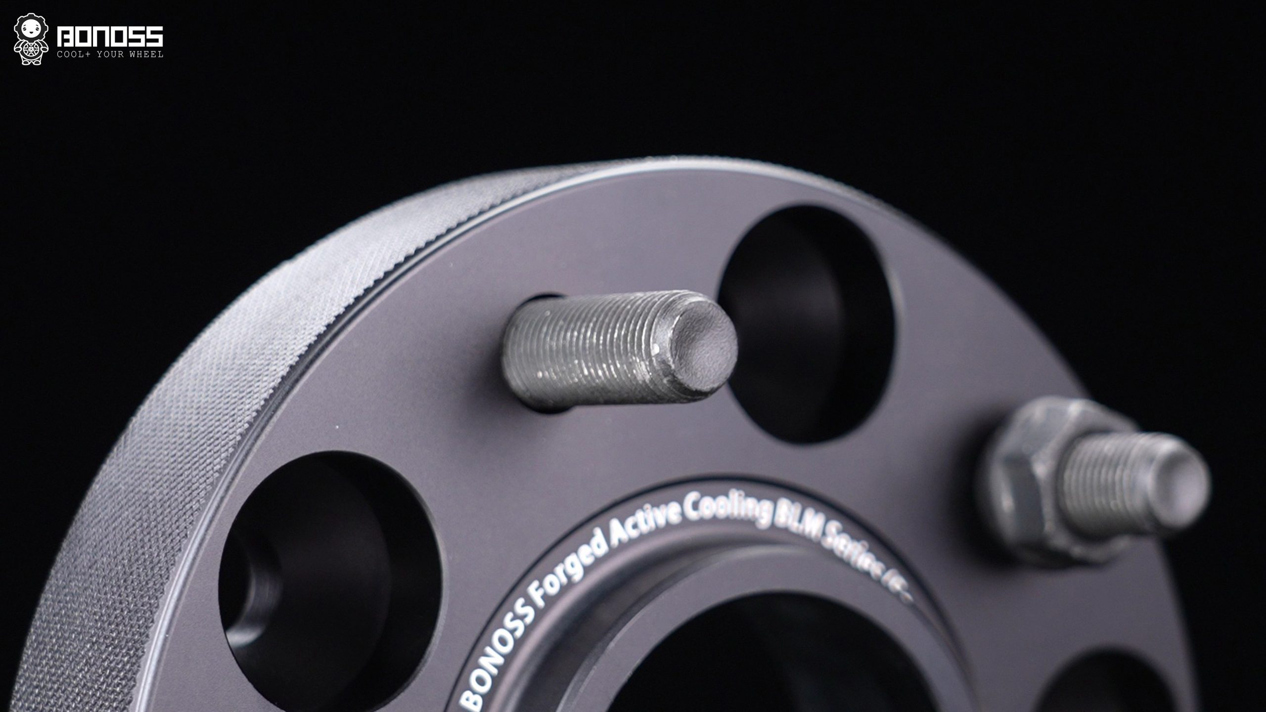 bonoss-iso-grade-12.9-wheel-studs-for-2021-jeep-wrangler Forged wheel studs with M14x1.5 threads on a BONOSS spacer intended for a Wrangler JL Rubicon hub-centric fitment.