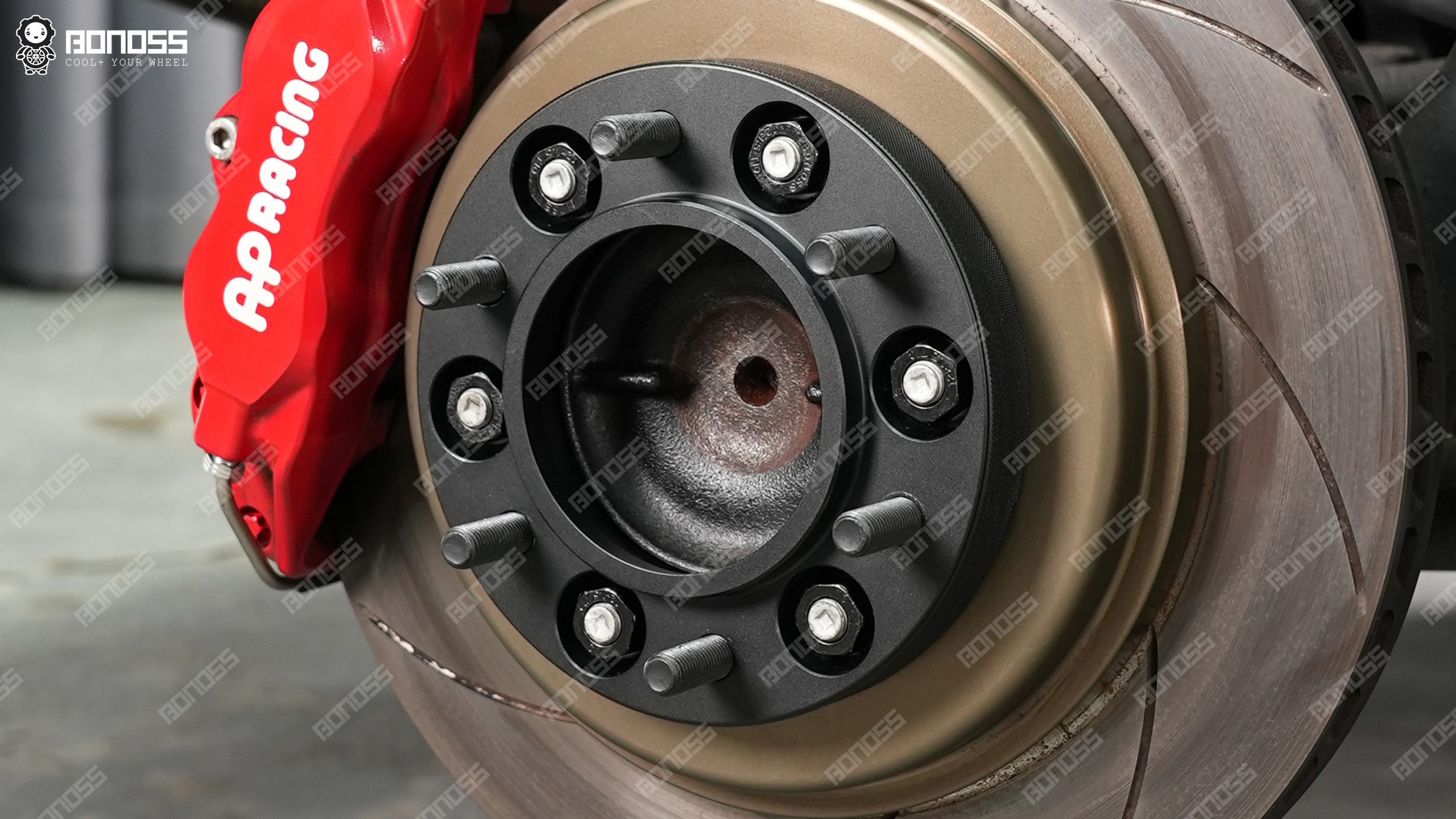 bonoss-lexus-gx-hub-centric-spacers-mounted-axle Close-up view of a hub-centric Lexus GX wheel spacer properly seated on the axle face before wheel installation.