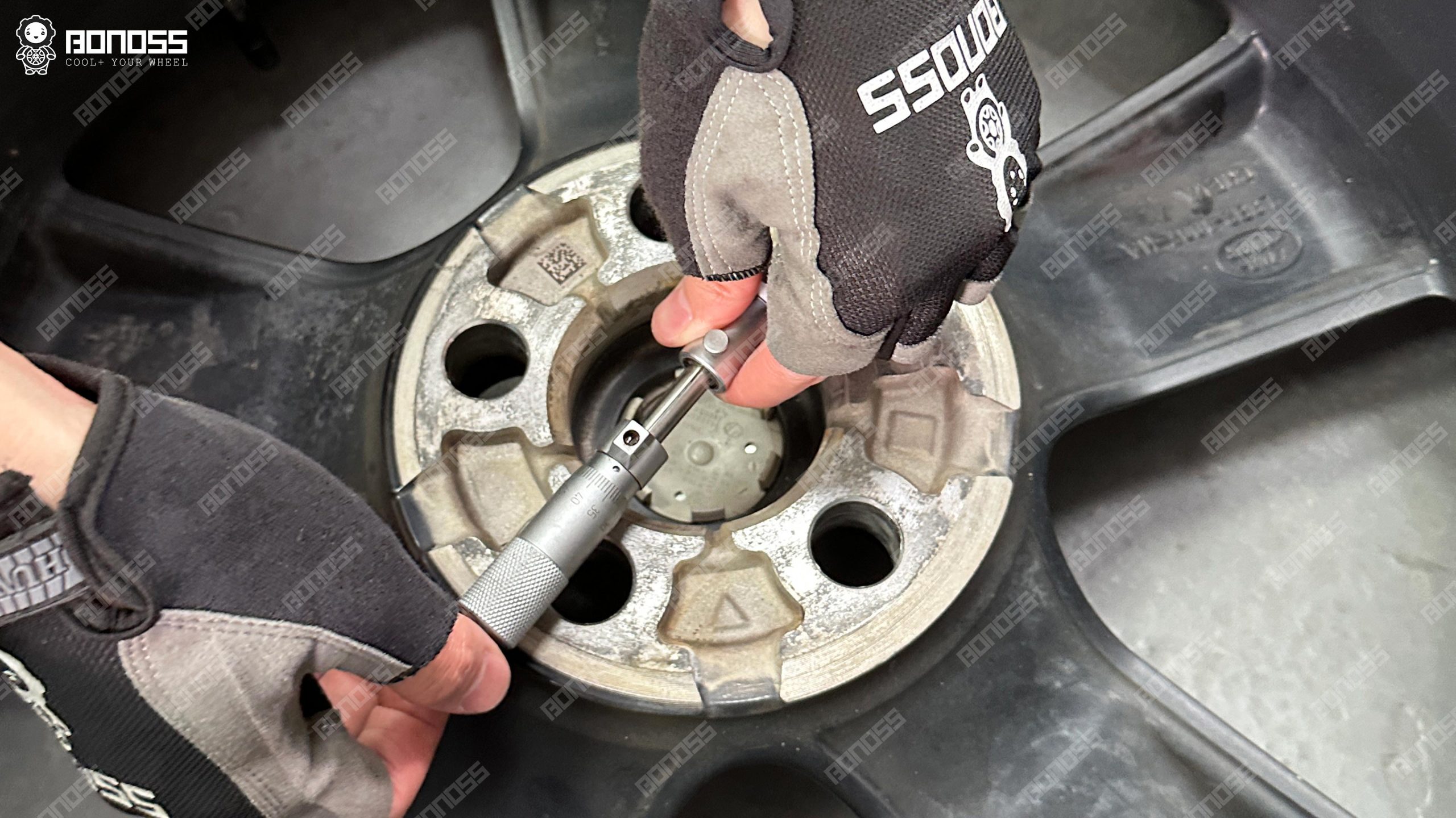 defender-5×120-wheel-spacers-wheel-center-bore-micrometer-reading Precision gauge reads the inner diameter of the wheel hub opening for Defender 5x120 wheel spacers compatibility verification.