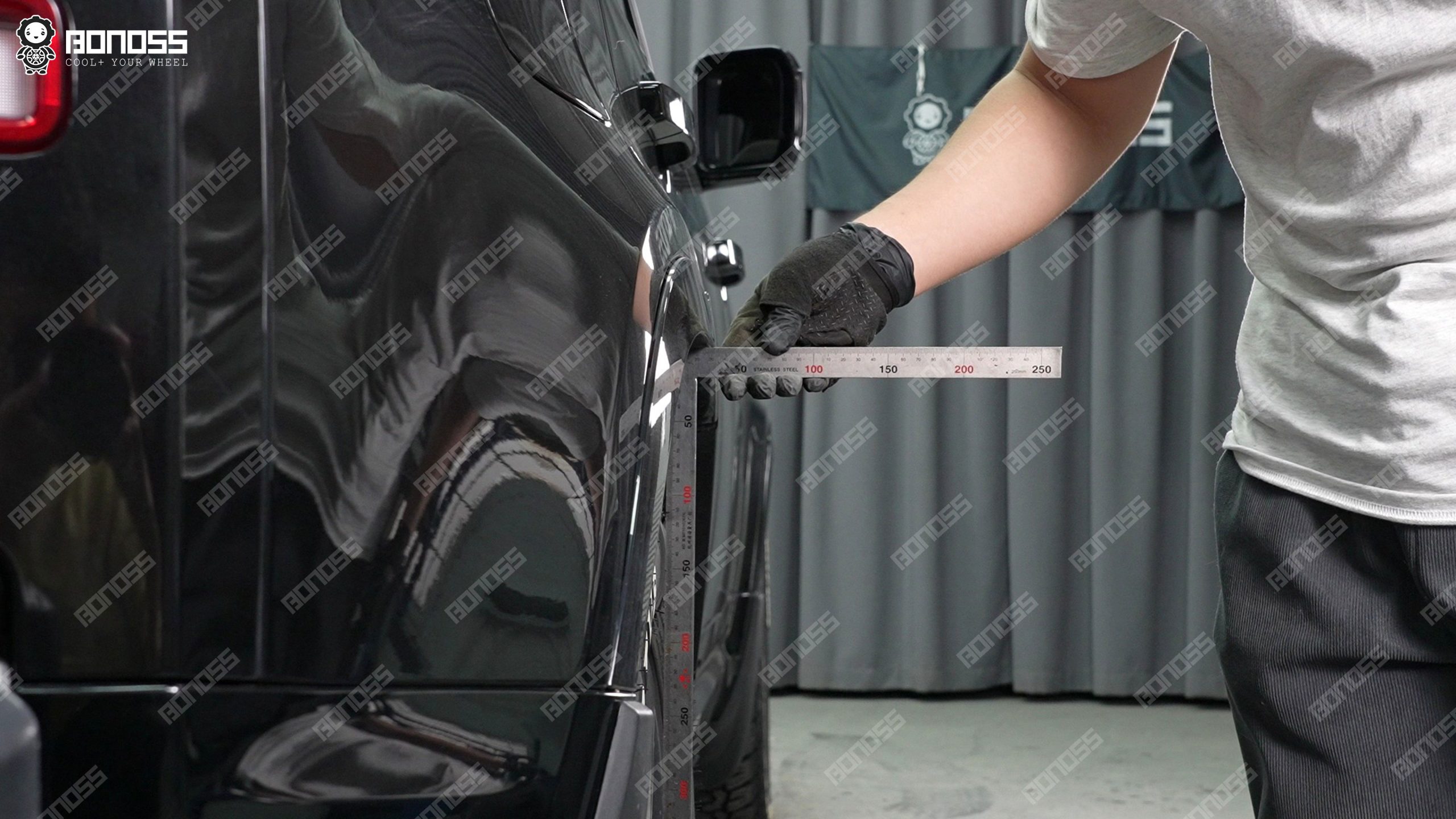 defender-l663-hubcentric-wheel-spacers-rear-fender-clearance-ruler Measuring tool checks how much gap exists before installing Defender L663 hubcentric wheel spacers on the right rear arch.