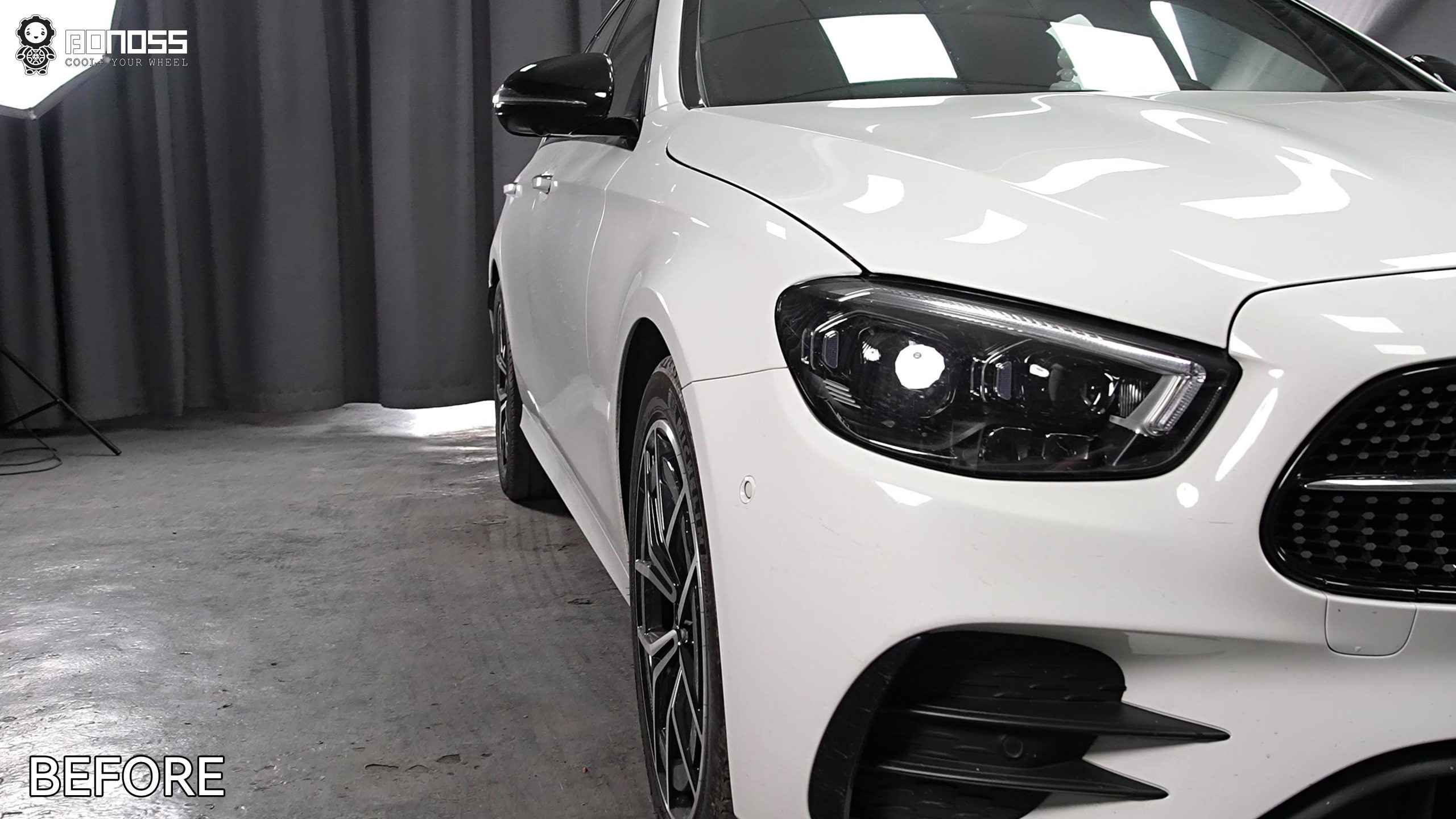 e-class-15mm-spacers-before-and-after-left-front-wheel-before-shot Left-front wheel of a stock 2021 Mercedes-Benz E-Class sitting recessed inside the fender arch.