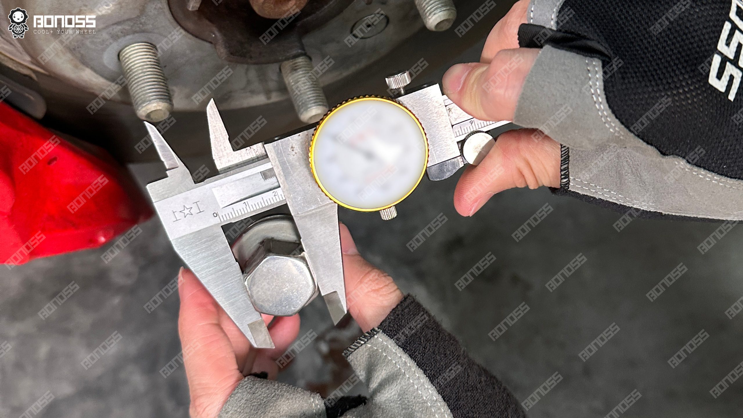 land-rover-defender-35mm-spacers-factory-lug-nut-22mm-hex-caliper Digital measuring tool confirms the socket dimension needed when fitting Land Rover Defender 35mm spacers to the factory wheel hardware.