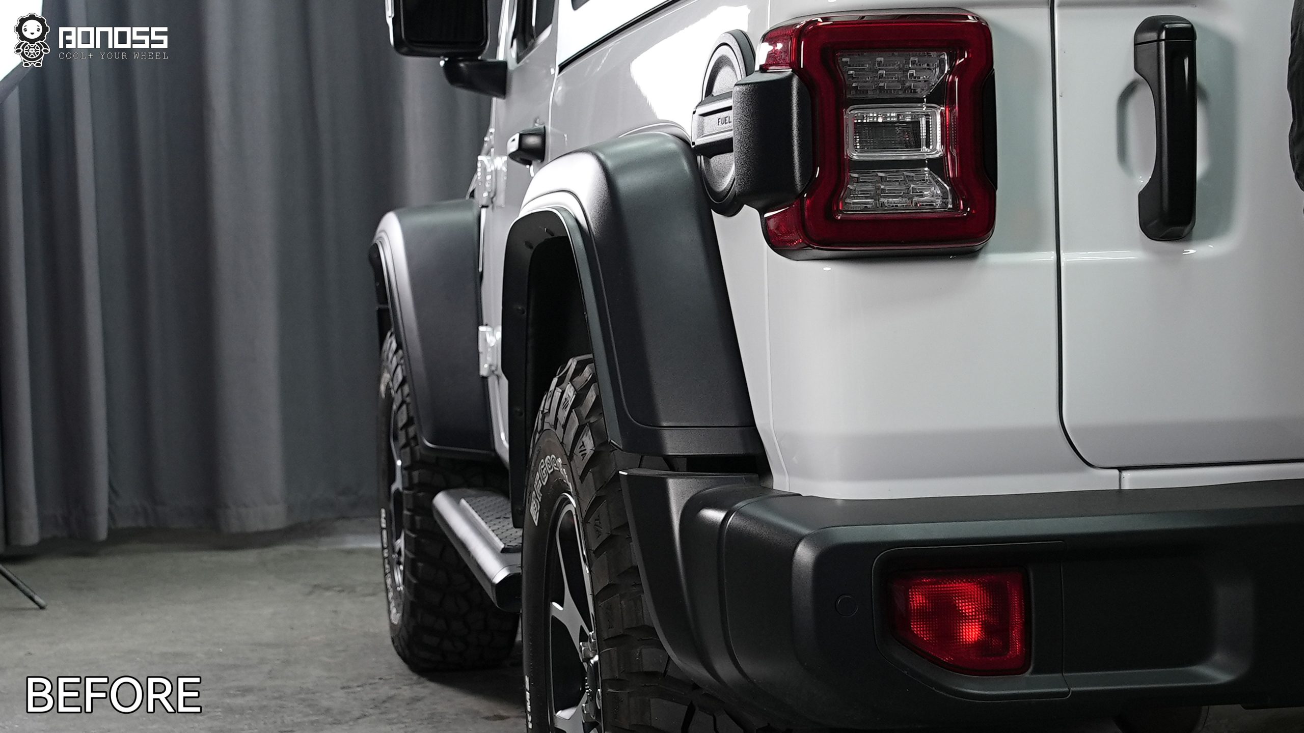 left-rear-wheel-tucked-before-spacers-jeep-wrangler-jl Stock left rear corner of a 2021 Wrangler Rubicon with the tire inset beneath the rear fender prior to modification.