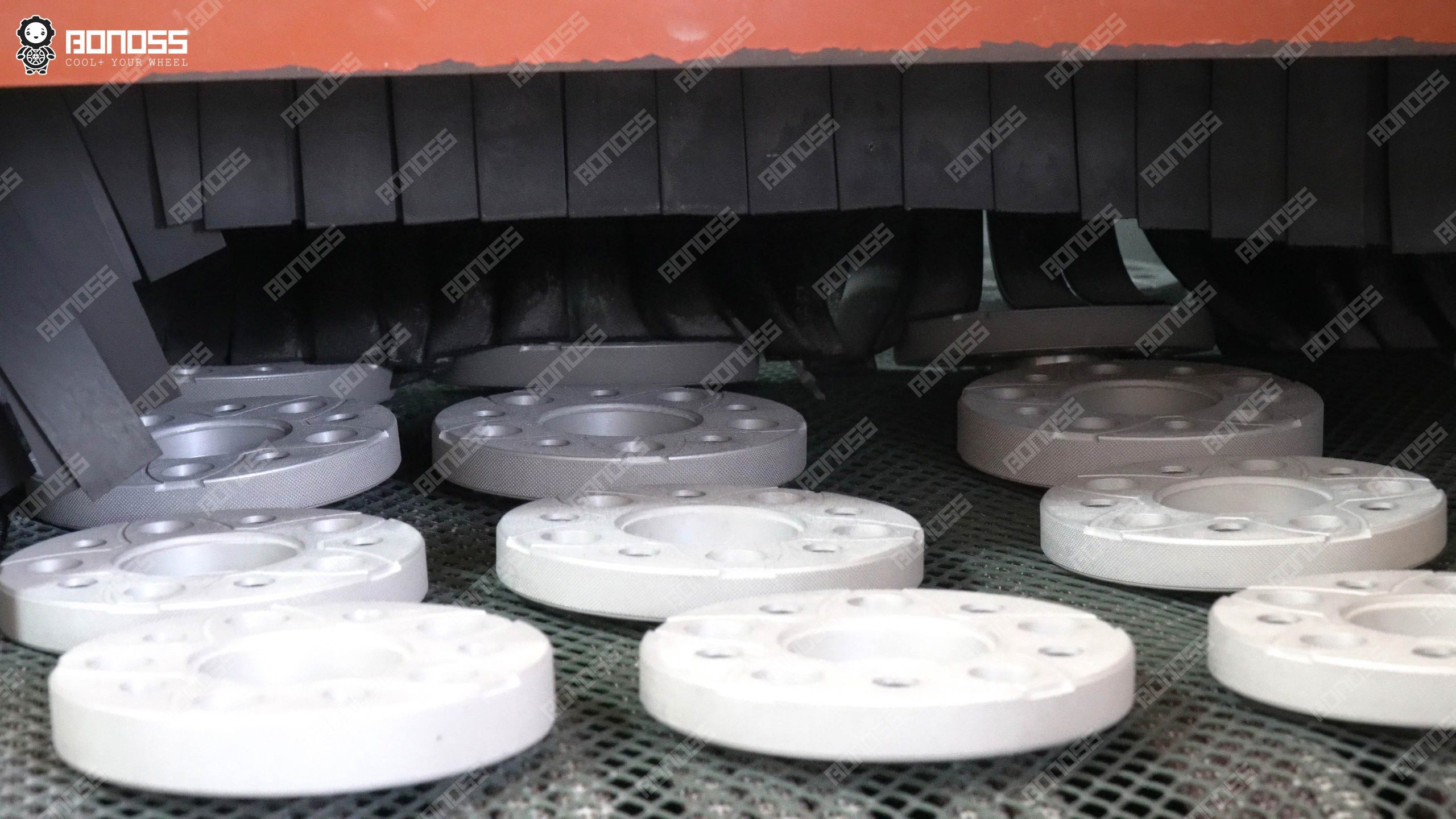 lexus-gx-spacers-hard-anodizing-surface-treatment Anodizing treatment applying a corrosion-resistant oxide finish to a BONOSS Lexus GX wheel spacer during the manufacturing process.