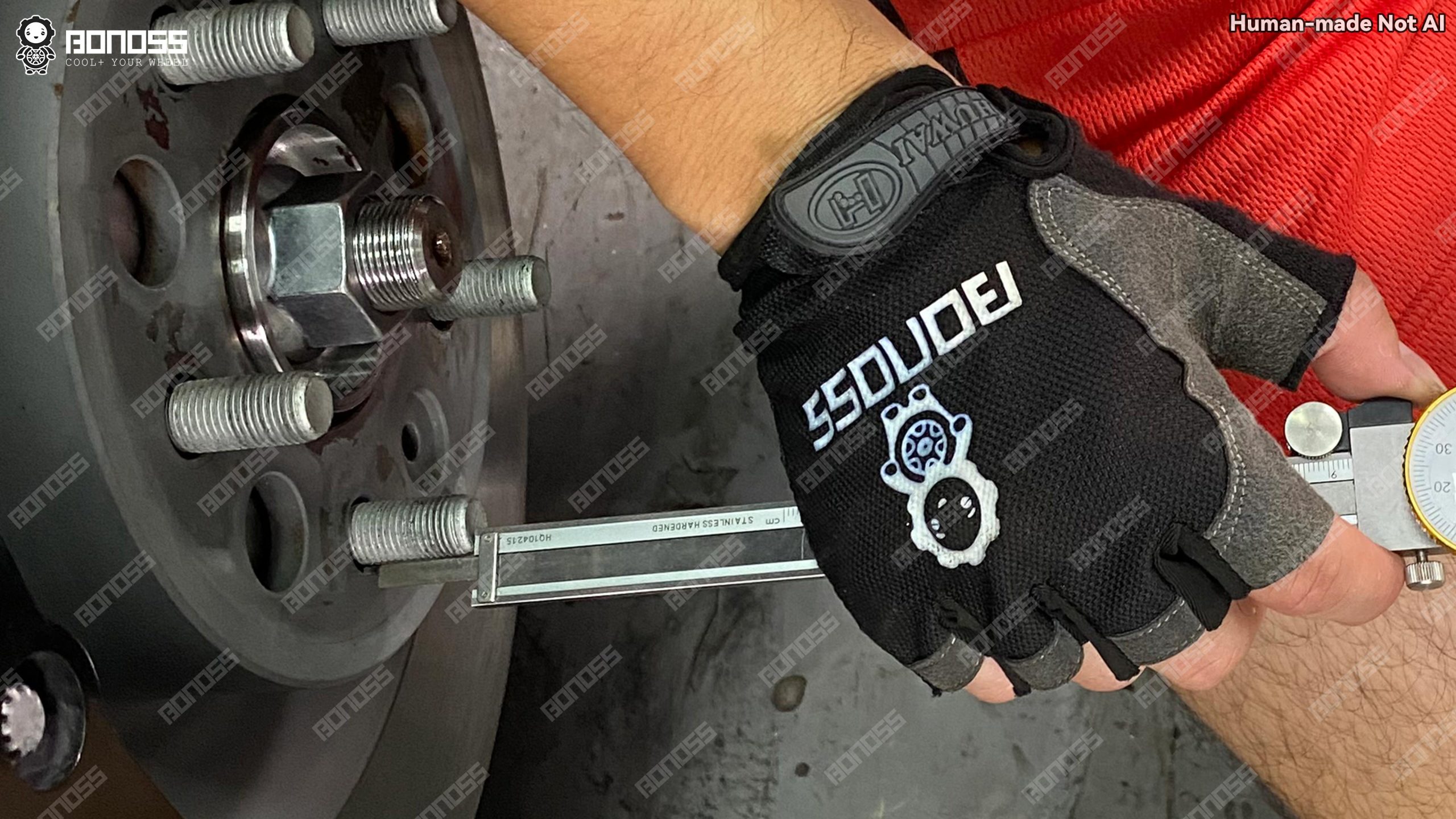 measuring-stud-protrusion-length-on-2023-tesla-model-x-axle-hub Checking exposed wheel stud length on a 2023 Tesla Model X before fitting 20mm spacers.