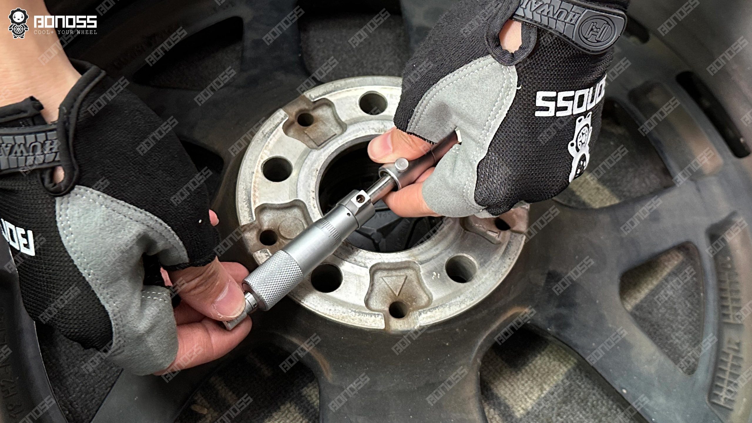 micrometer-checking-wheel-bore-for-66-6mm-hub-bore-spacers-e-class Micrometer measuring the 66.61mm OEM wheel center bore for 66.6mm hub bore spacers E-Class fitment.