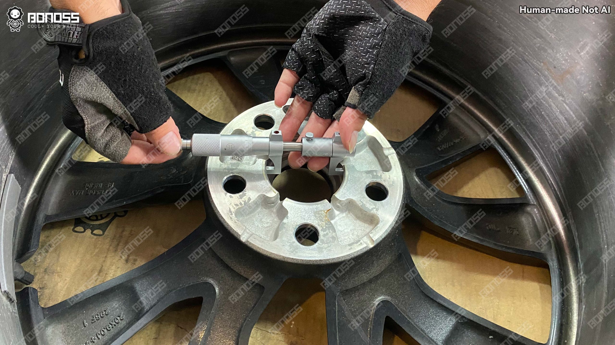 micrometer-reading-of-wheel-center-bore-for-2023-tesla-model-x Micrometer confirming the 64.27mm center bore of a stock 2023 Tesla Model X wheel.