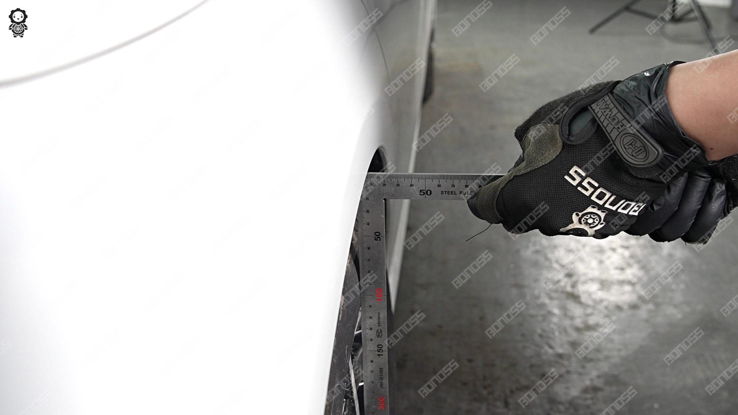 right-rear-flush-gap-ruler-check-2021-mercedes-benz-e-class-w213 Rear fender gap check with a ruler on the right-rear corner of a 2021 Mercedes-Benz E-Class.