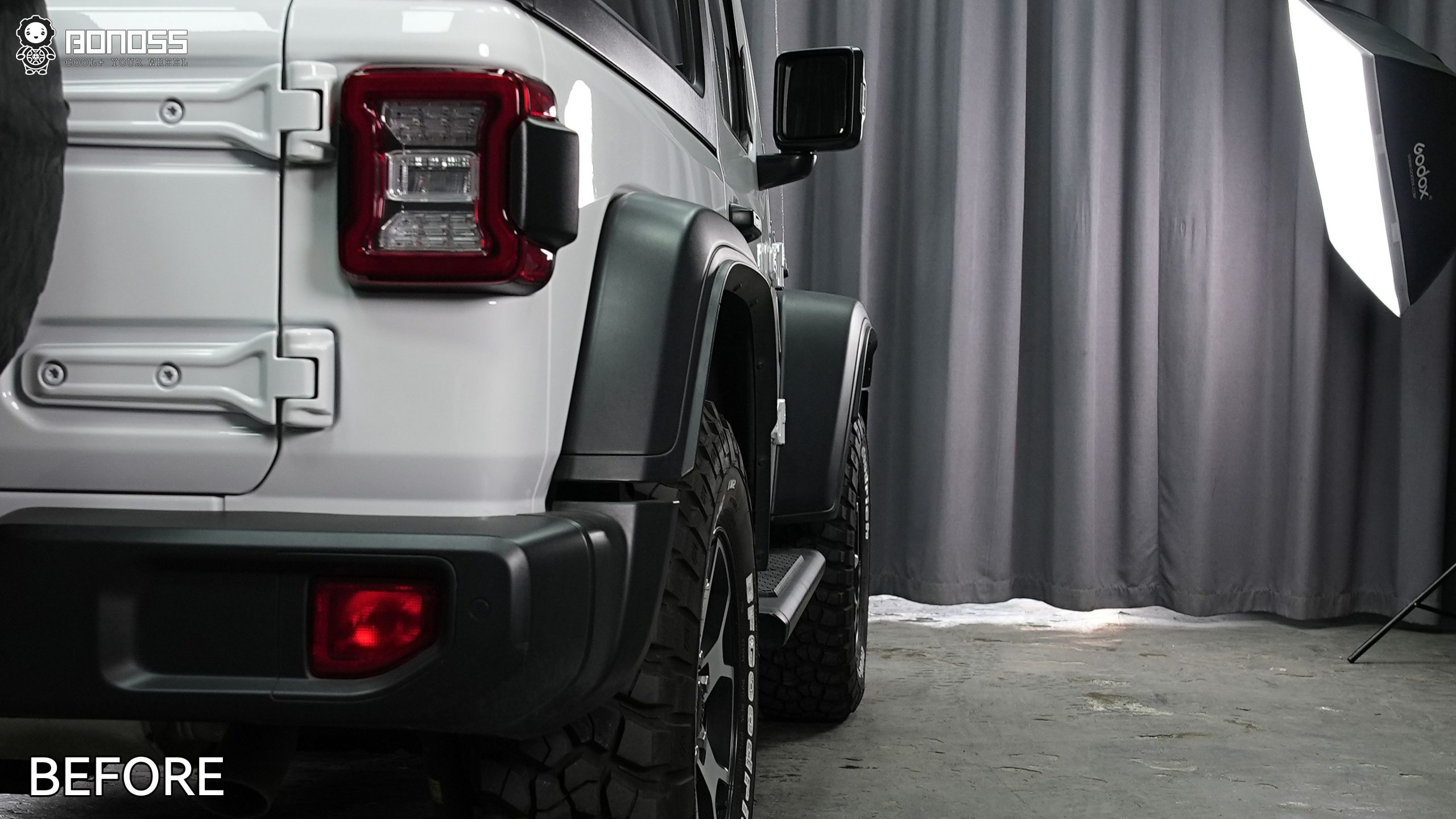 right-rear-wheel-inset-before-spacers-2021-jeep-wrangler Unaltered right rear corner of a Wrangler JL Rubicon with the factory tire sitting inset under the rear fender.