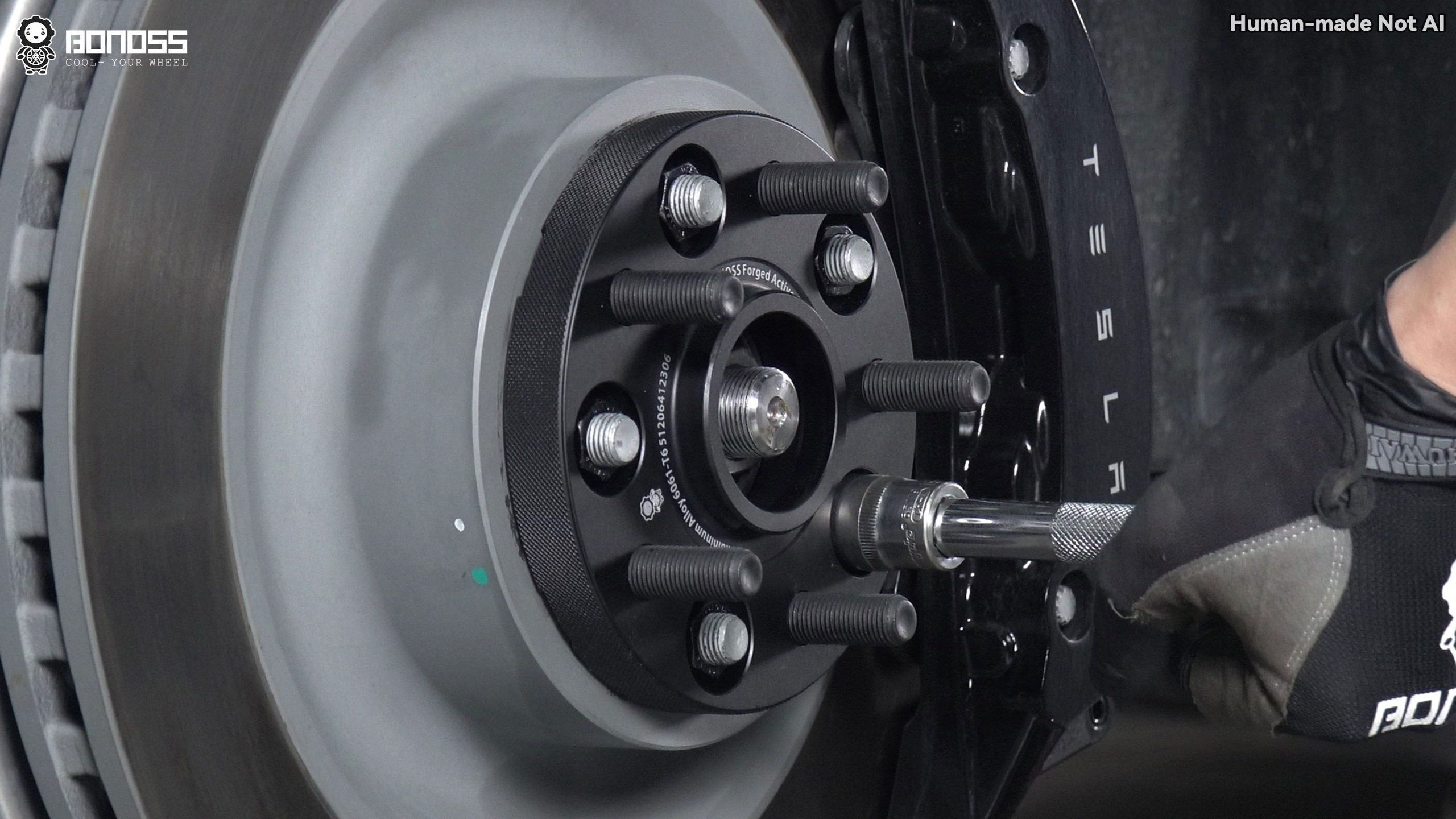 torquing-bonoss-spacer-onto-2023-tesla-model-x-front-hub 20mm spacer being torqued to spec on the front hub of a 2023 Tesla Model X.
