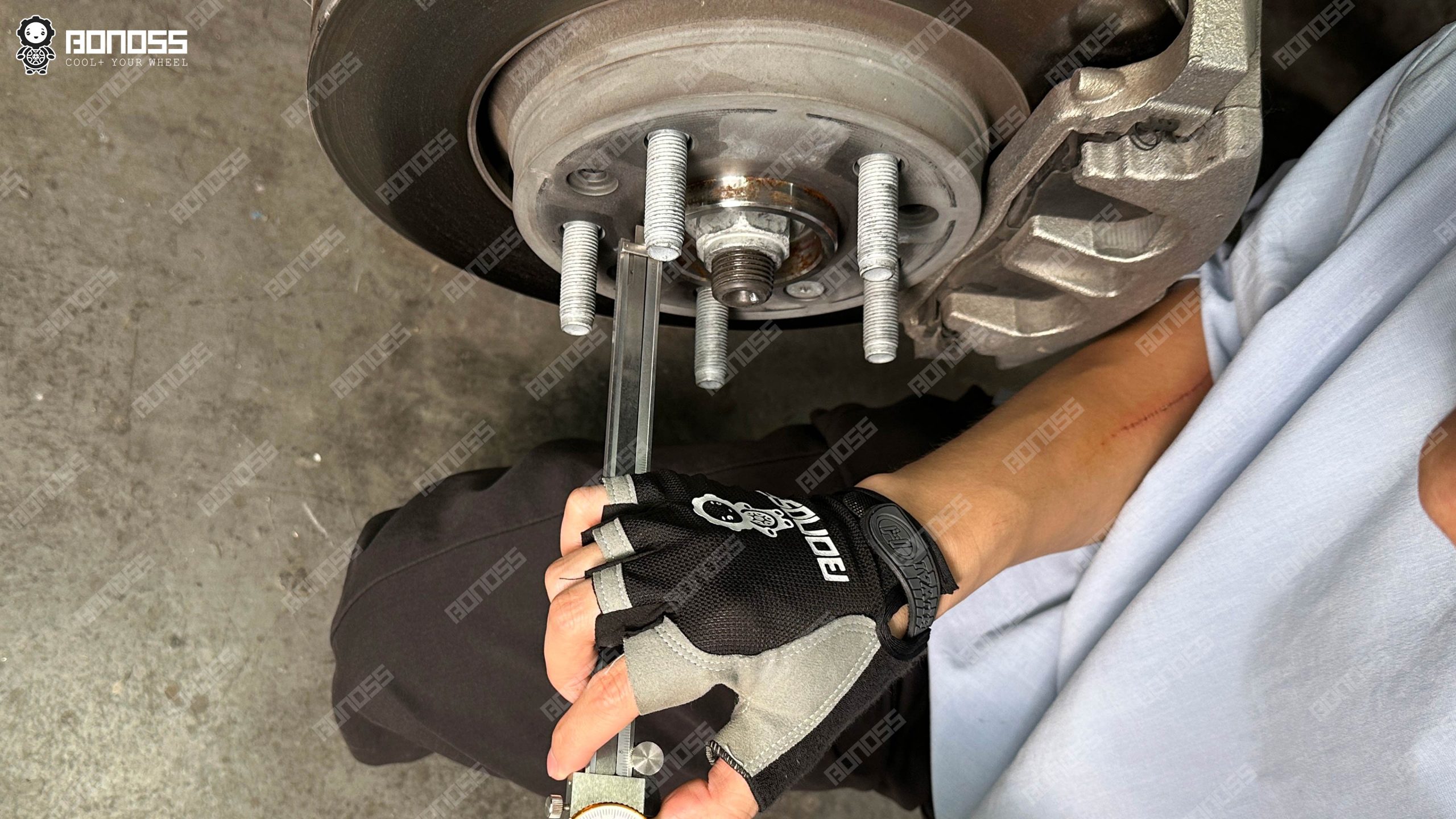 vernier-caliper-reads-hub-step-height-on-jeep-wrangler-jl Caliper jaws positioned over the hub register of a 2021 Wrangler to measure the pilot step height for spacer fitment.